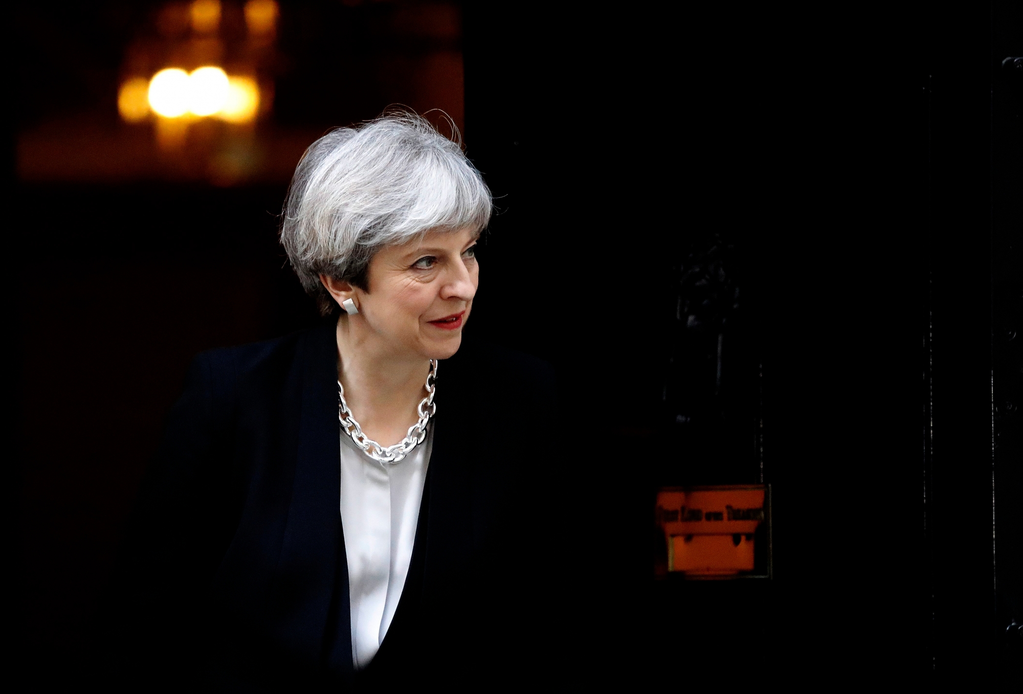 Britain's Prime Minister Theresa May walks to welcome Ukraine's President Petro Poroshenko prior to their talks, at 10 Downing Street in London, Wednesday, April 19, 2017. (AP Photo/Frank Augstein) Britain Ukraine