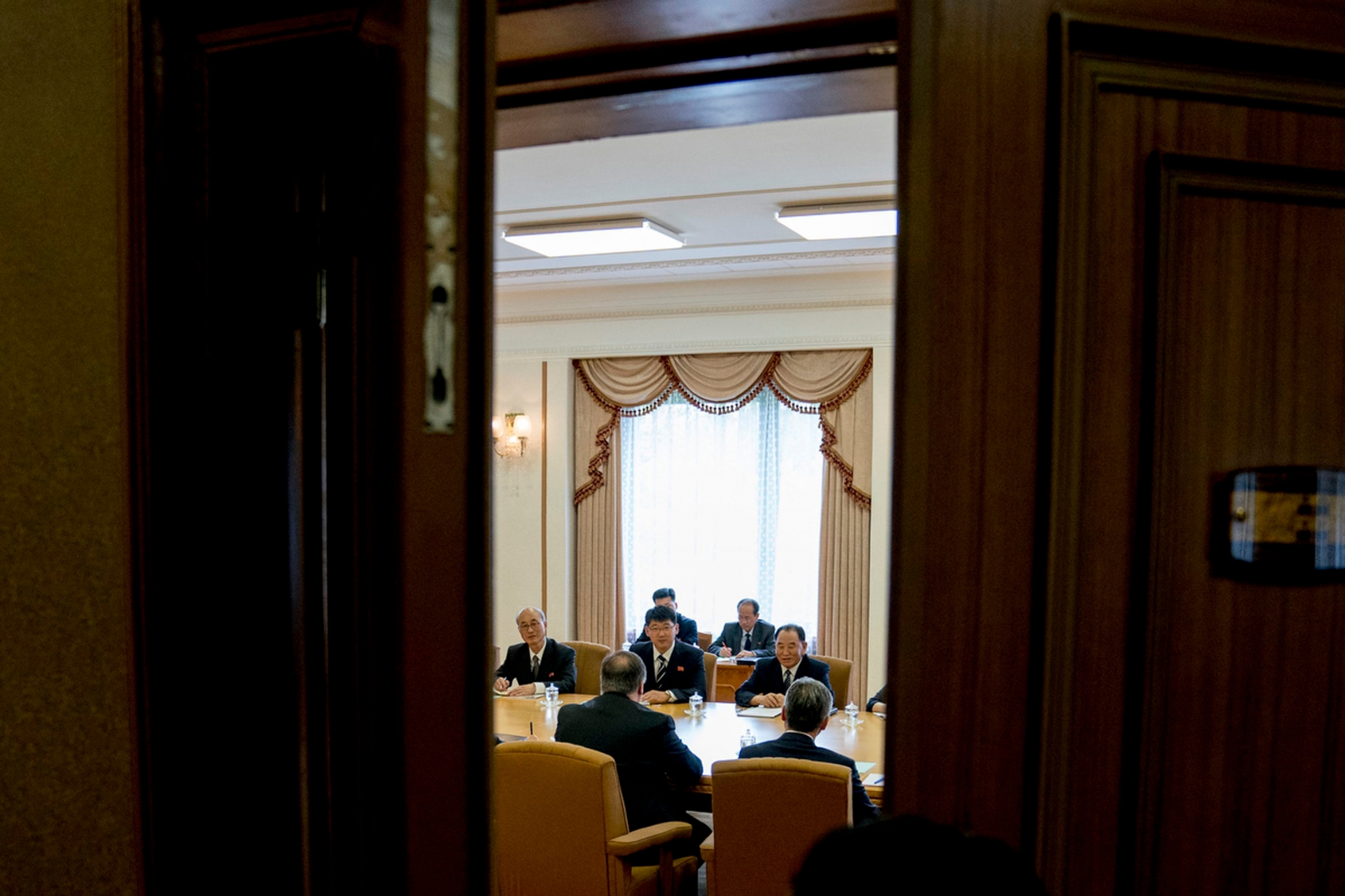 U.S. Secretary of State Mike Pompeo, bottom left, and Kim Yong Chol, top right, North Korean senior ruling party official and former intelligence chief, meet at the Park Hwa Guest House in Pyongyang, North Korea, Friday, July 6, 2018. Pompeo is on a trip traveling to North Korea, Japan, Vietnam, Abu Dhabi, and Brussels. (AP Photo/Andrew Harnik, Pool) North Korea US Pompeo