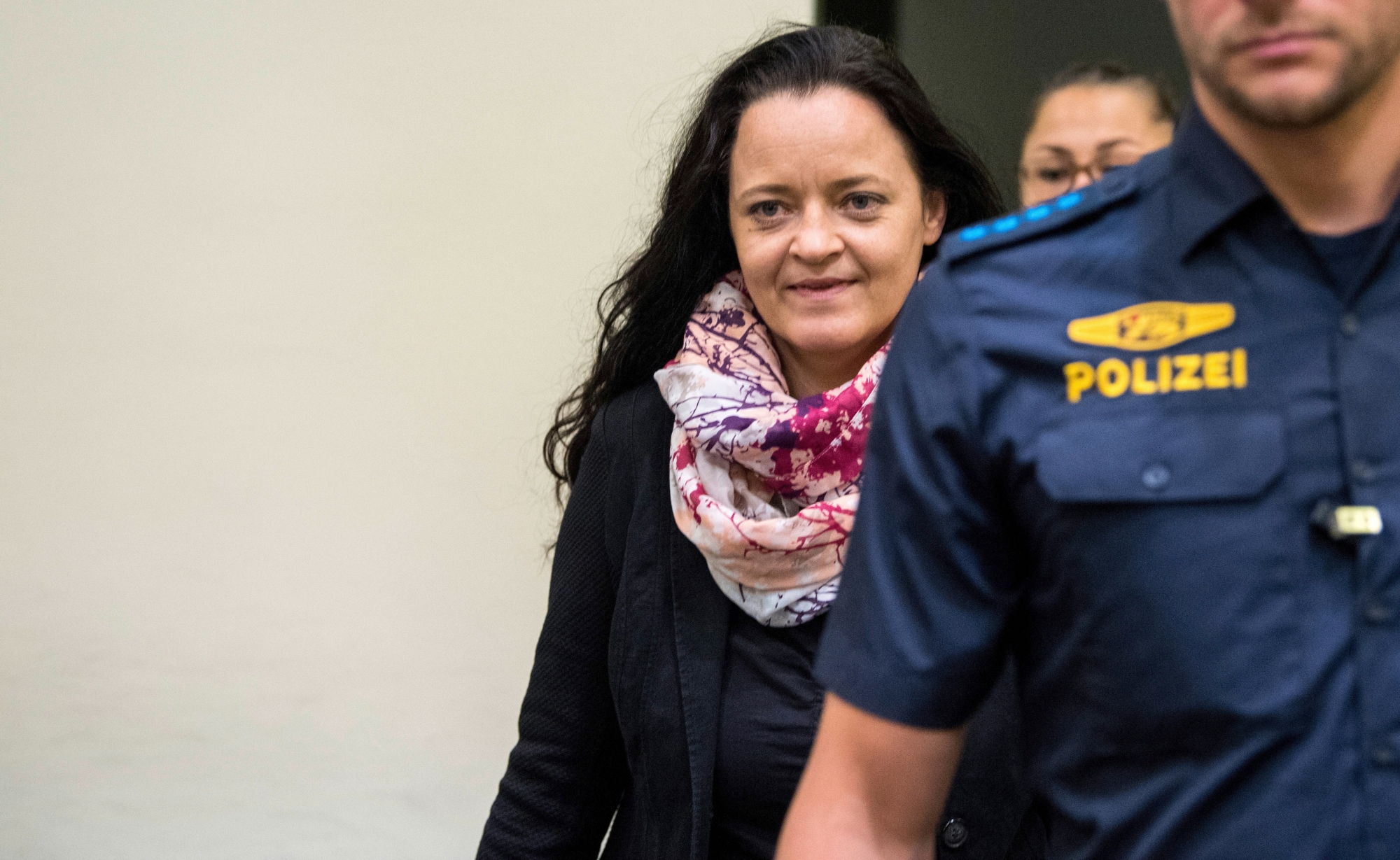 epa06879717 Defendant Beate Zschaepe (L) arrives to the NSU trial at the higher regional court (Oberlandesgericht, OLG) in Munich,  Germany, 11 July 2018.  The court found Zschaepe guilty on ten counts of murder on 11 July 2018, some five years after the trial started. The court sentenced her to life imprisonment and established the particular severity of guilt. Zschaepe was accused of being a founding member of the extreme right-wing National Socialist Underground (NSU) terror cell and faced charges of complicity in the murder of nine Turkish and Greek immigrants and a policewoman between 2000 and 2007, as well as two bombings in immigrant areas of Cologne, and 15 bank robberies.  EPA/MARC MUELLER GERMANY TRIALS NSU