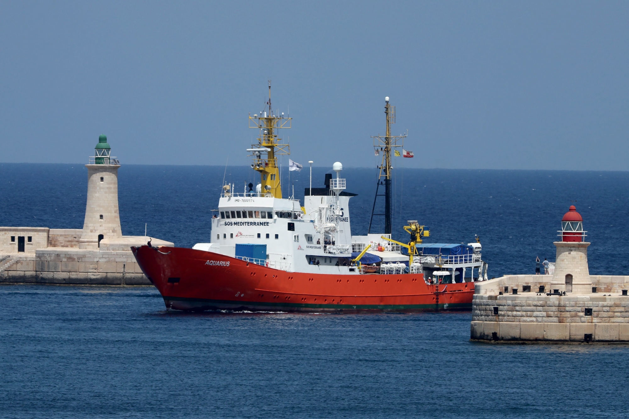 epa06951215 The SOS Mediterranee NGO rescue vessel MV Aquarius, which was stranded in the Mediterranean with some 141 migrants on board, enters the Grand Harbour in Senglea, Valletta, Malta, 15 August 2018. The migrant rescue ship was allowed to dock in Malta on the day after days at sea with some 141 migrants on board - who were rescued off the Libyan coast Libya on 10 August - and since then turned away from Italian ports, media reported. Malta reached an agreement with Germany, Spain, Portugal, France and Luxembourg to allow the ship to dock before sending the migrants to the five countries.  EPA/DOMENIC AQUILINA MALTA MIGRATION AQUARIUS VESSEL