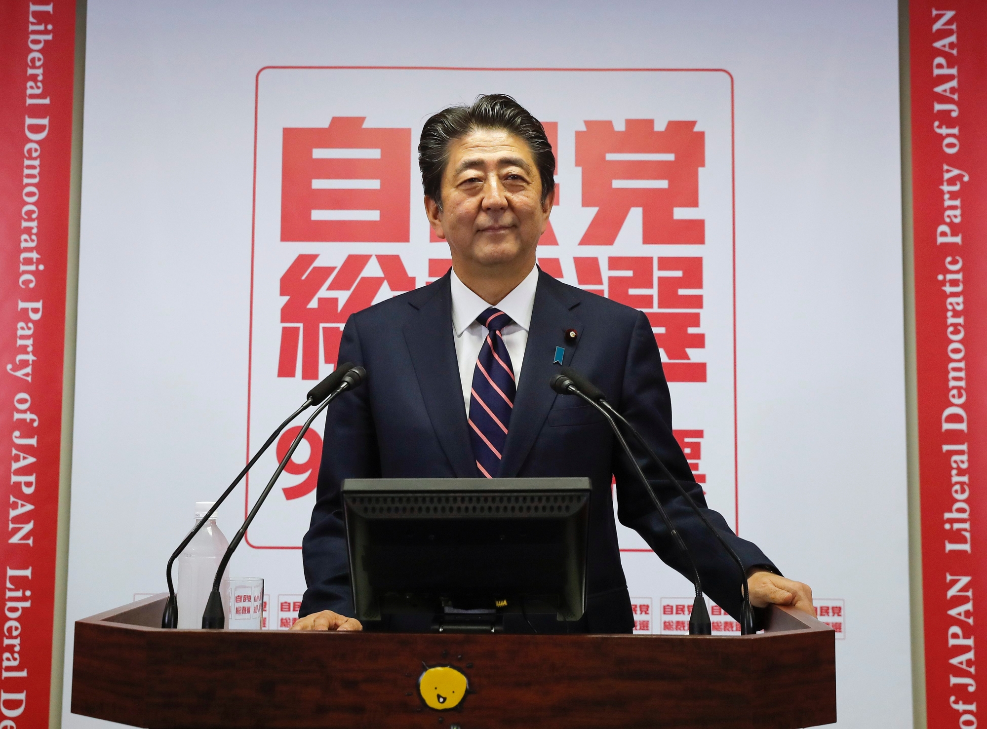 epa07034256 Japan's Prime Minister and President of the ruling Liberal Democratic Party (LDP) Shinzo Abe speaks at his news conference at the LDP headquarters in Tokyo, Japan, 20 September 2018 after being re-elected as President of the LDP. By winning a third term as leader of the LDP, Abe is to become Japan's longest-serving prime minister, realizing first-ever amendment to the Constitution.  EPA/KIMIMASA MAYAMA JAPAN POLITICS ABE