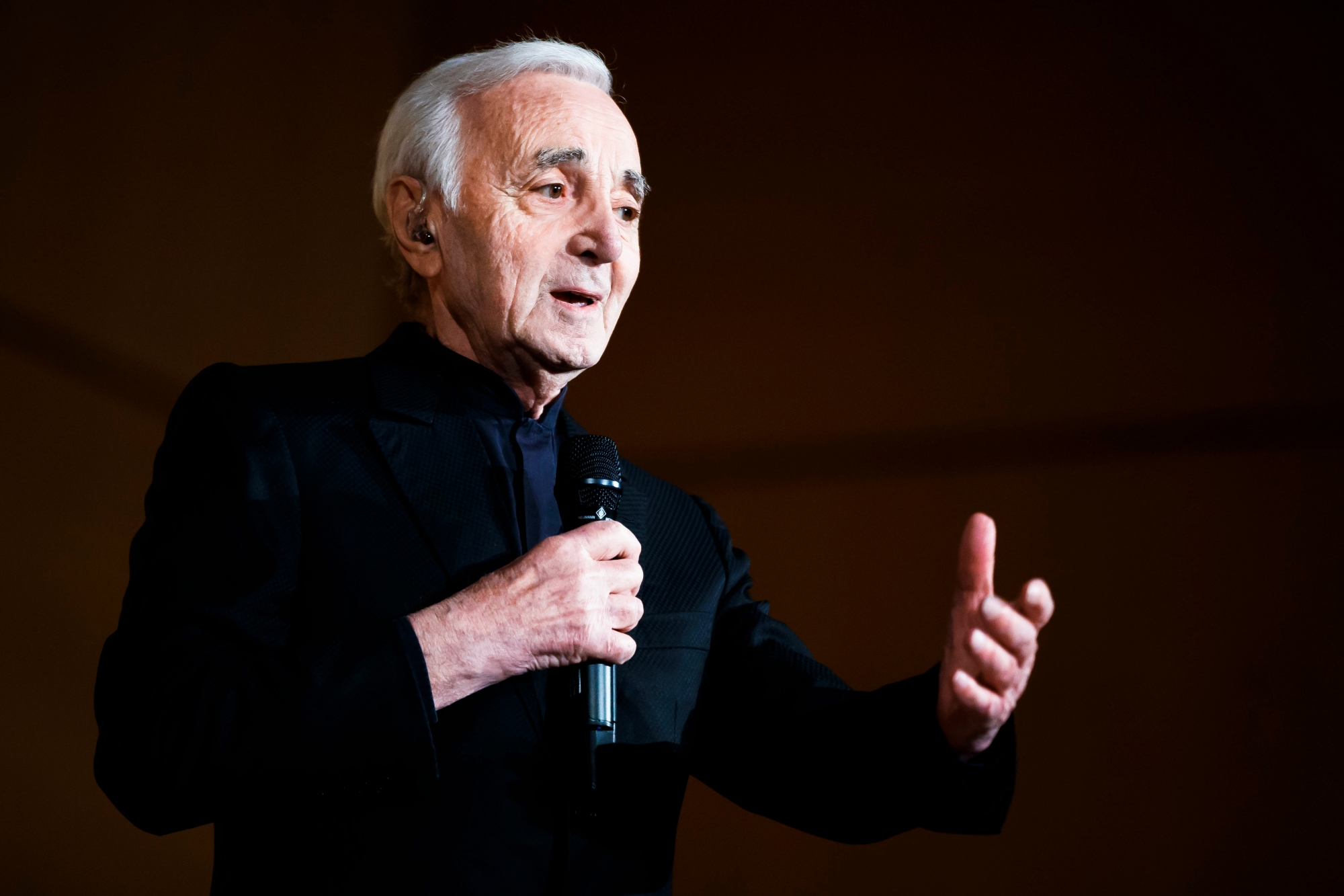 Armenian born French singer Charles Aznavour performs during the "Grand Concert de la Francophonie" held in honor of Armenia, upcoming host country of the 17th Francophone Summit of the International Organization of French speakers, at the European headquarters of the United Nations in  in Geneva Switzerland, Tuesday, March 13, 2018. (KEYSTONE/Valentin Flauraud) SWITZERLAND CONCERT FRANCOPHONIE