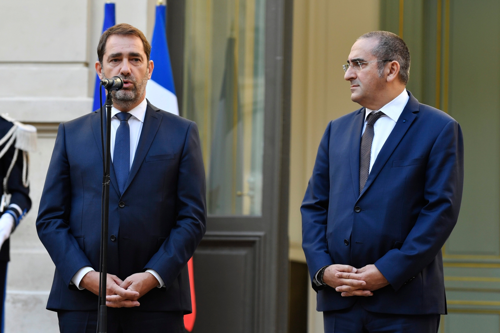 epa07096770 Newly-appointed French Interior Minister Christophe Castaner (L) and new French junior Minister Laurent Nunez (R) attend the official handover ceremony with French Prime Minister Edouard Philippe (unseen) in Paris, France, 16 October 2018. Castaner succeeds Gerard Collomb, who withdrew from the post earlier in October to run for Mayor of Lyon.  EPA/JULIEN DE ROSA FRANCE GOVERNMENT PRIME MINISTER