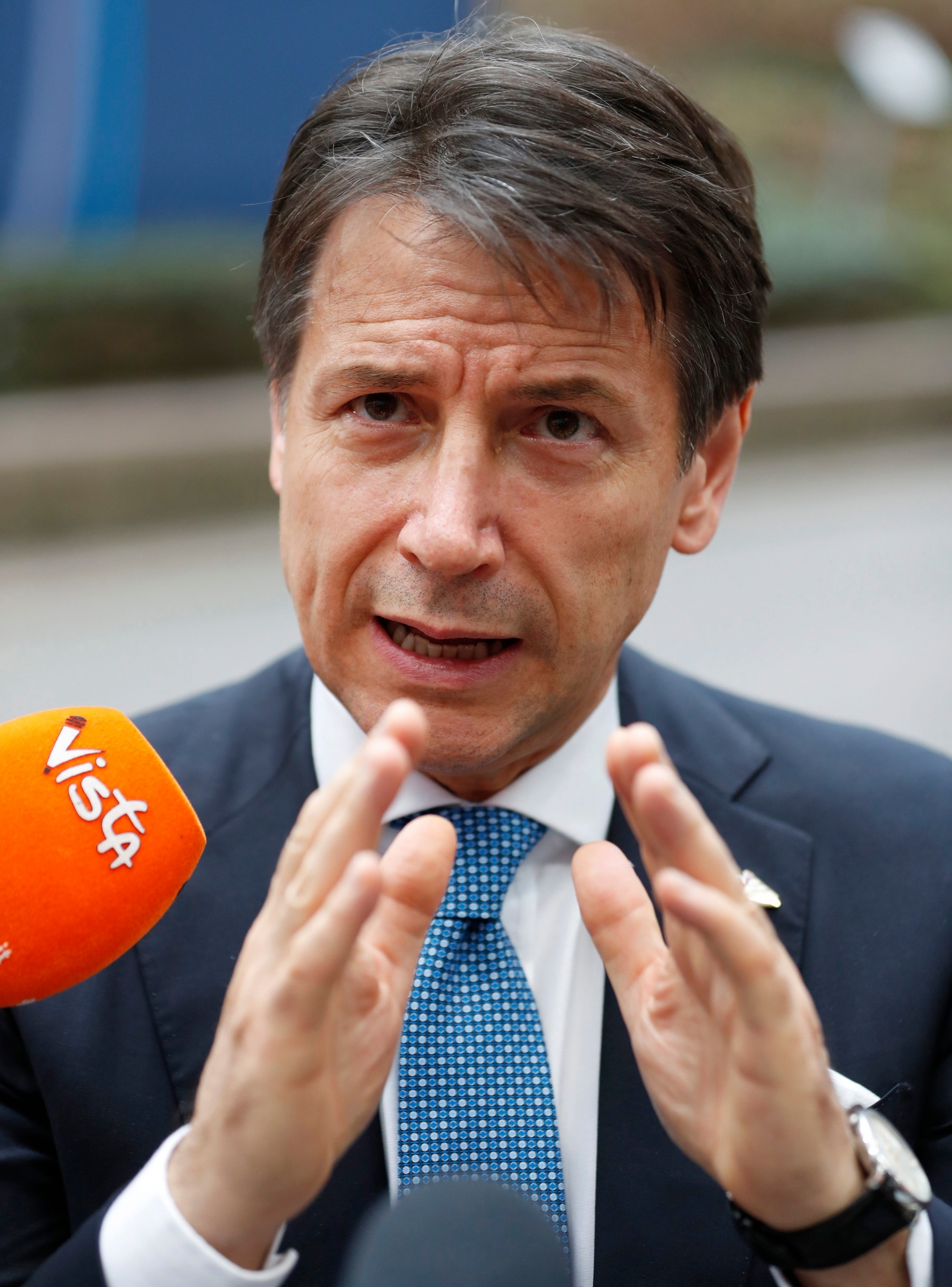 Italian Prime Minister Giuseppe Conte speaks with the media as he departs an EU-ASEM summit in Brussels, Friday, Oct. 19, 2018. EU leaders met with their Asian counterparts Friday to discuss trade, among other issues. (AP Photo/Alastair Grant) Belgium EU Asia