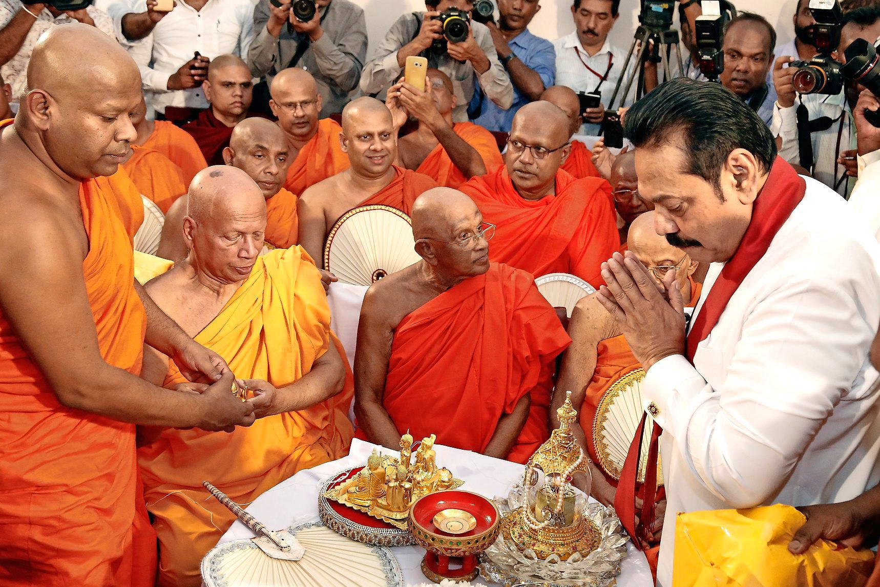 epa07128842 Former Sri Lankan President Mahinda Rajapaksa takes part in religious observances prior to assuming duties as the new Prime Minister at the Prime MinisterÄôs office in Colombo, Sri Lanka 29 October 2018. Sri Lankan President Maithripala Sirisena appointed Mahinda Rajapaksa as the new Prime Minister after removing Ranil Wickremesinghe from the post on Friday night. Even as the newly appointed former President and incumbent Kurunegala District Member of Parliament officially assumed duties, the former Premier Ranil Wickremesinghe still claims that he is legally the Prime Minister and refuses to leave the official Prime Ministerial residence ÄòTemple TreesÄô.  EPA/M.A.PUSHPA KUMARA SRI LANKA POLITICS