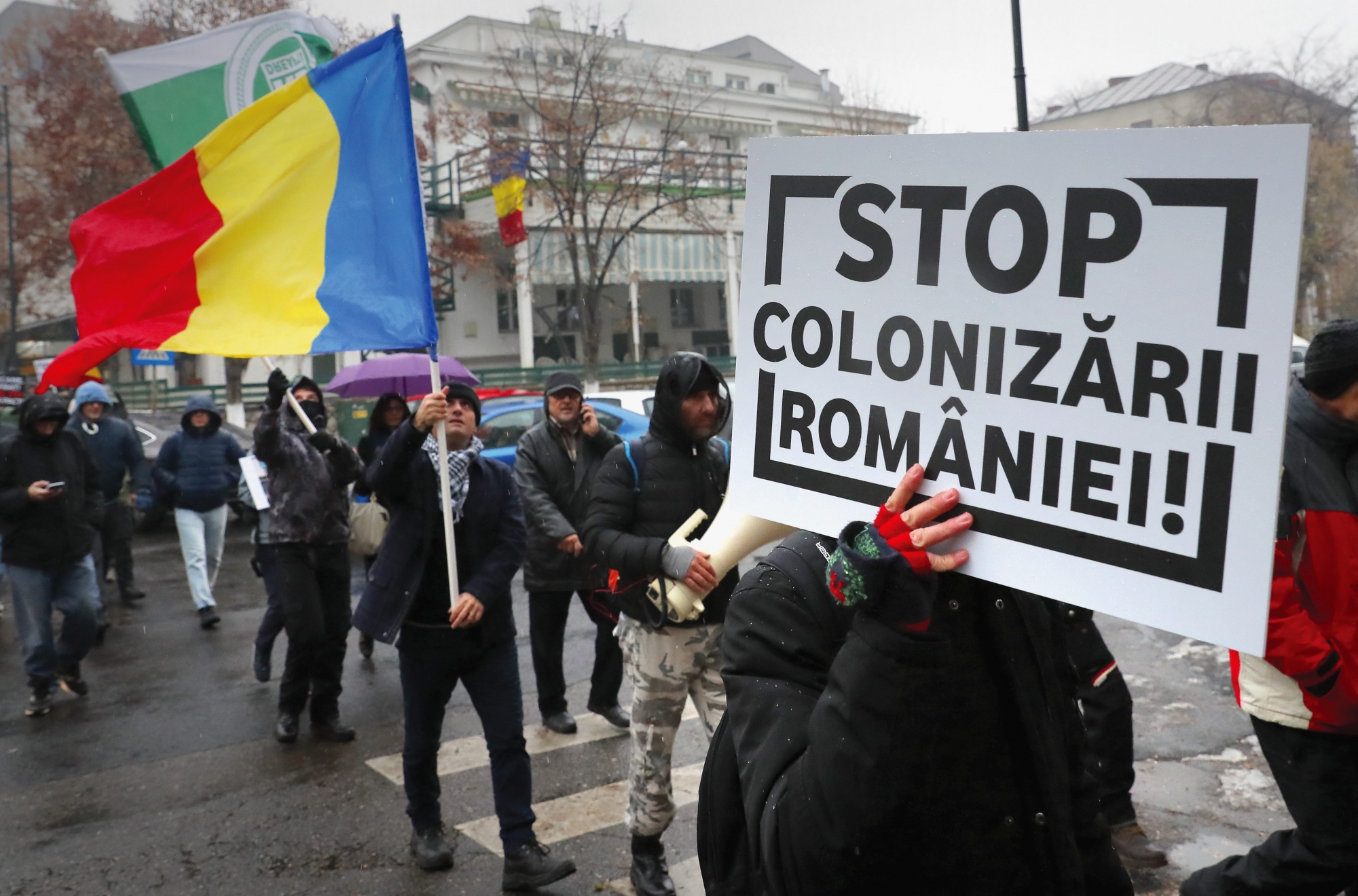 epa07210214 An anti-migration protester carries a placard reading Stop Colonizing Romania', while attending a rally in downtown Bucharest, Romania, 05 December 2018. Anti-migration activists, nationalist supporters and orthodox church supporters marched through Romania's capital to ask the government not to sign the the Global Migration Compact agreement next week. The European Union's migration commissioner is calling on member countries that have turned against a UN- backed migration pact to reconsider their opposition, after few EU nations announced they will pulled out of  signing the accord during the 01 - 11 December conference in Morocco.
The Intergovernmental Conference to Adopt the Global Compact for Safe, Orderly and Regular Migration takes place in Marrakech, Morocco on the 10th and 11th of December, 2018, after being convened by the United Nations General Assembly.  EPA/ROBERT GHEMENT ROMANIA MIGRATION PROTEST