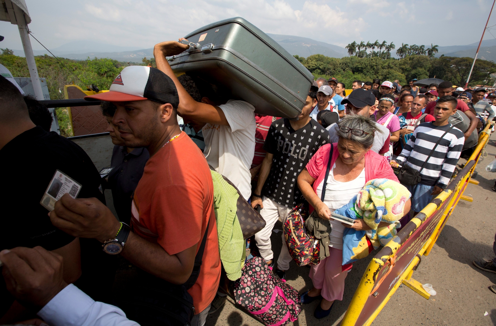 In this Feb. 21, 2018 photo, Venezuelans cross the International Simon Bolivar bridge into the Colombia. As Venezuela's economic crisis worsens, rising numbers are fleeing in a burgeoning refugee crisis that could soon match the flight of Syrians from the war-torn Middle East. (AP Photo/Fernando Vergara) The Week That Was from Latin America