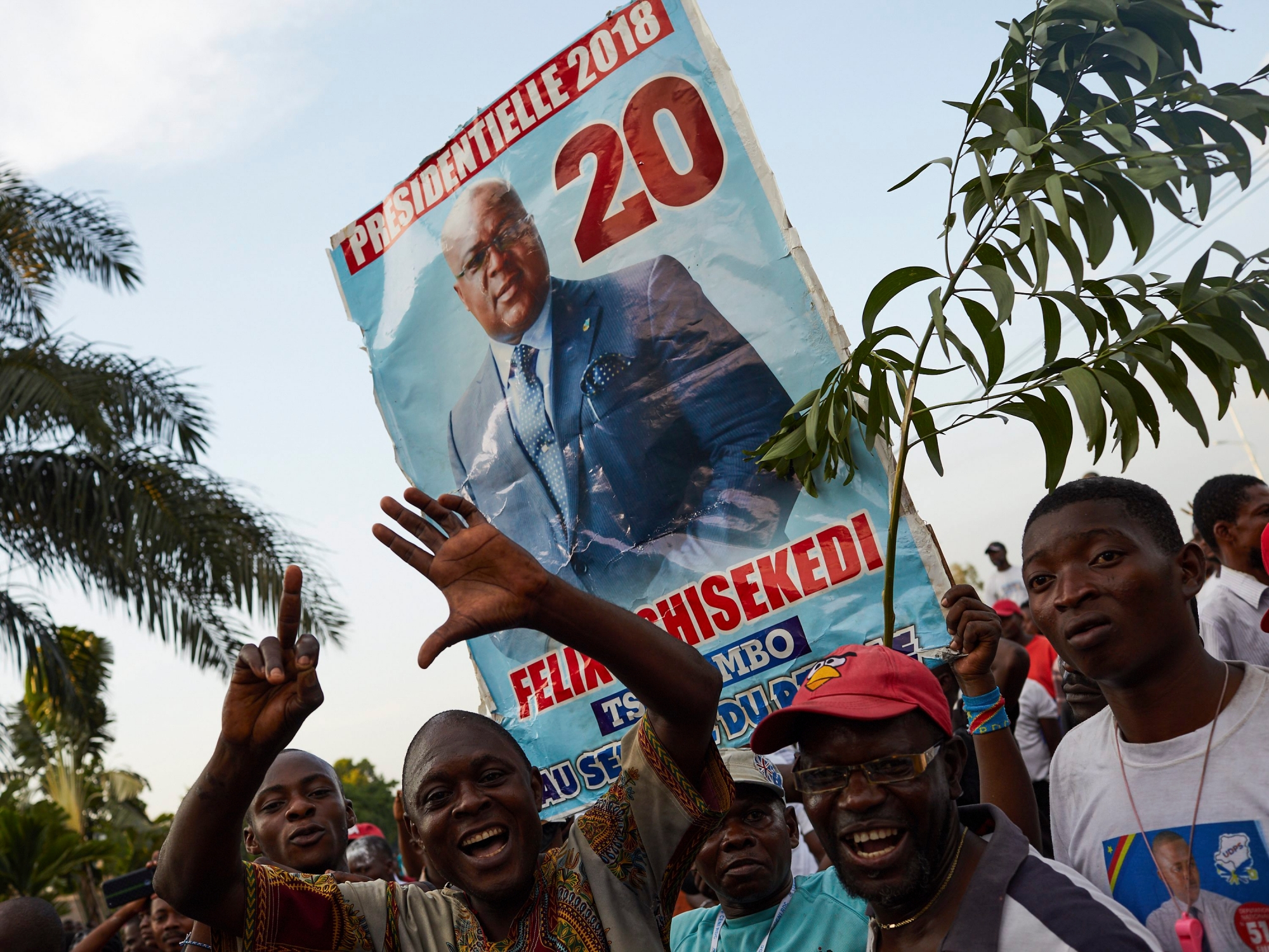 epaselect epa07271963 Supporters of DR Congo's opposition candidate for the Presidential election, Felix Tshisekedi, the leader of the Union for Democracy and Social Progress (UDPS) party, rally outside his party headquarters in Limete, Kinshasa, as they wait for the electoral commission to announce the provisional results, in Democratic Republic of the Congo, 09 January 2019. Riot police officers have been deployed at the commission headquarters amid fears of violence as the country awaits for the the announcement of the Presidential election result.  EPA/HUGH KINSELLA CUNNINGHAM epaselect DR CONGO ELECTIONS