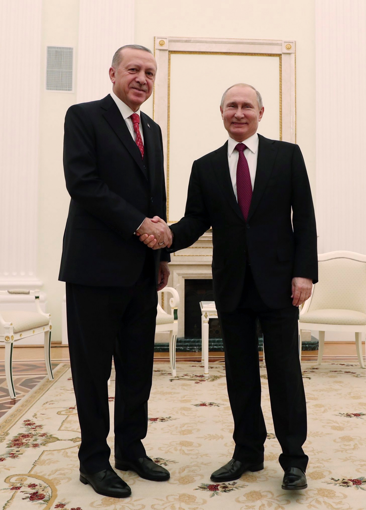 Turkey's President Recep Tayyip Erdogan, left, shakes hands with Russia's President Vladimir Putin, right, prior to their meeting in Moscow, Russia, Wednesday, Jan. 23, 2019. (Presidential Press Service via AP, Pool) Russia Turkey