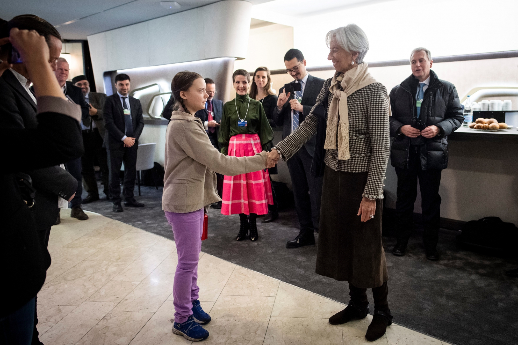 16 year old Swedish climate activist Greta Thunberg, left, meets with France's Christine Lagarde, Managing Director of the International Monetary Fund, right, during the 49th annual meeting of the World Economic Forum, WEF, in Davos, Switzerland, Friday, January 25, 2019. The meeting brings together entrepreneurs, scientists, corporate and political leaders in Davos under the topic ÄúGlobalization 4.0Äù from 22 - 25 January 2019. (KEYSTONE/Gian Ehrenzeller) SWITZERLAND WORLD ECONOMIC FORUM WEF