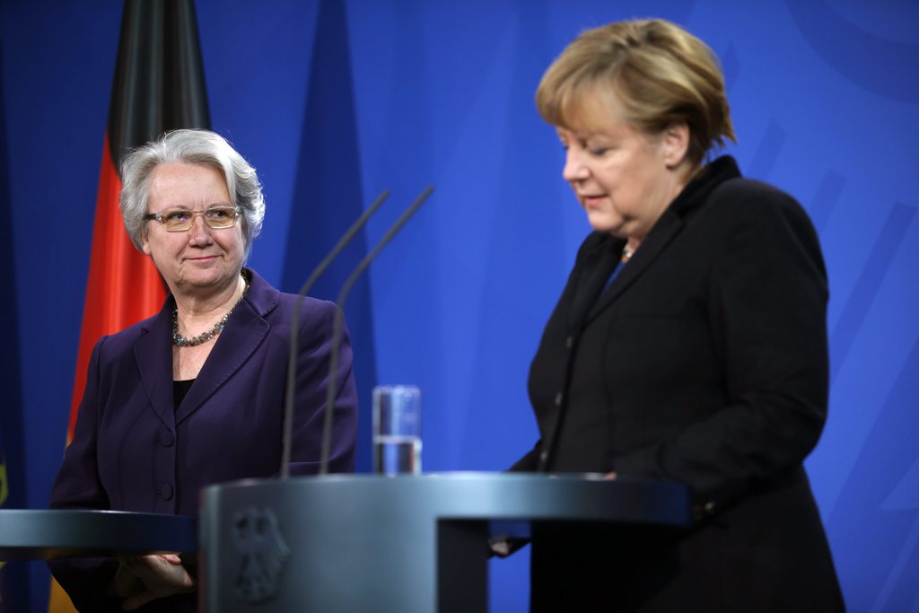epa03575012 German Chancellor Angela Merkel (R) and German Education and Research Minister Annette Schavan give a statement to the media to announce Schavan's resignation, at the chancellery in Berlin, Germany, 09 February 2013. Germany's embattled Education and Science Minister Annette Schavan resigned 09 February over a plagiarism scandal, dealing an election-year blow to Angela Merkel's government. A university panel 07 February found the Christian Democratic Union (CDU) minister guilty of 'deliberate deception' for using foreign text passages without proper citation in her 33-year-old thesis. Chancellor Merkel in the joint news conference with Schavan said she had accepted her resignation 'with a heavy heart' and praised the minister's achievements in her 17-year political career.  EPA/MICHAEL KAPPELER