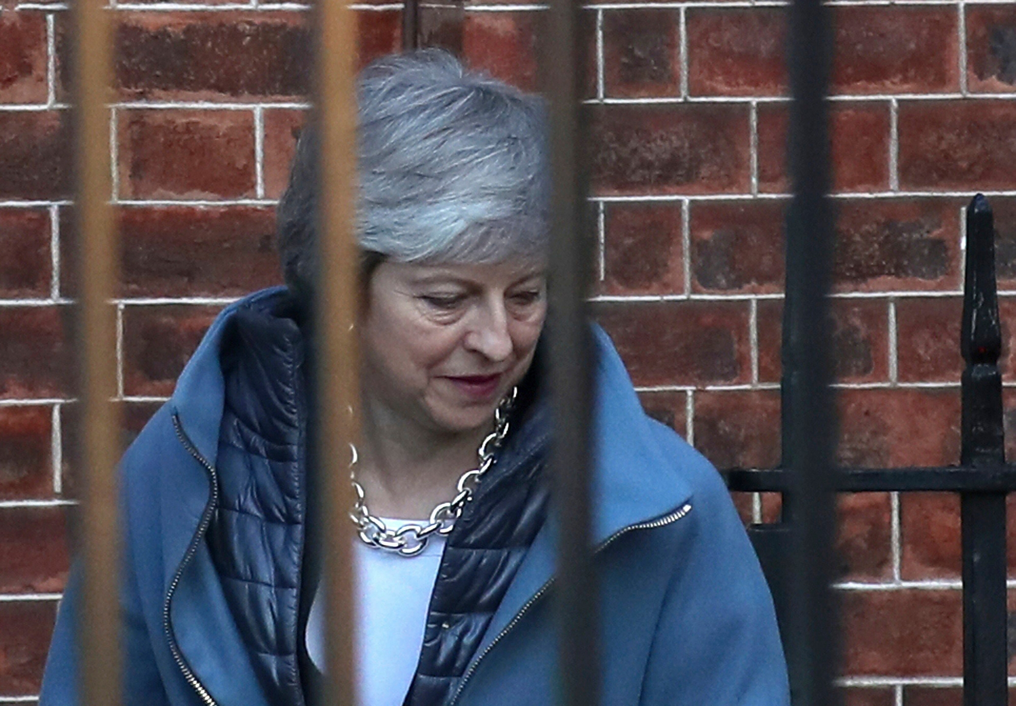 Britain's Prime Minister Theresa May leaves 10 Downing Street for the House of Commons ahead of a Brexit vote, in London, Thursday, Feb. 14, 2019.  May was scrambling Thursday to avoid another defeat on her Brexit plans amid opposition from members of her own party who claim she is moving in the wrong direction in efforts to overcome the impasse blocking a deal. (Steve Parsons/PA via AP) Britain Brexit