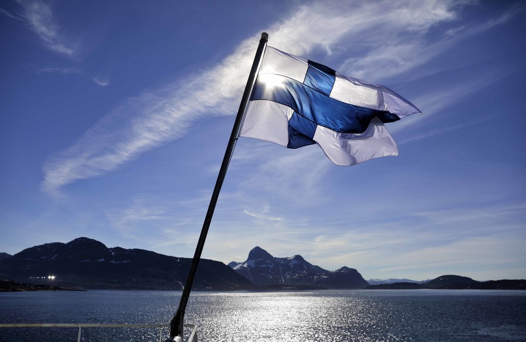 The flag of Finland flies aboard the Finnish icebreaker MSV Nordica as it arrives into Nuuk, Greenland, after traversing the Northwest Passage through the Canadian Arctic Archipelago, Saturday, July 29, 2017. After 24 days at sea and a journey spanning more than 10,000 kilometers (6,214 miles), the MSV Nordica has set a new record for the earliest transit of the fabled Northwest Passage. The once-forbidding route through the Arctic, linking the Pacific and the Atlantic oceans, has been opening up sooner and for a longer period each summer due to climate change. (AP Photo/David Goldman)