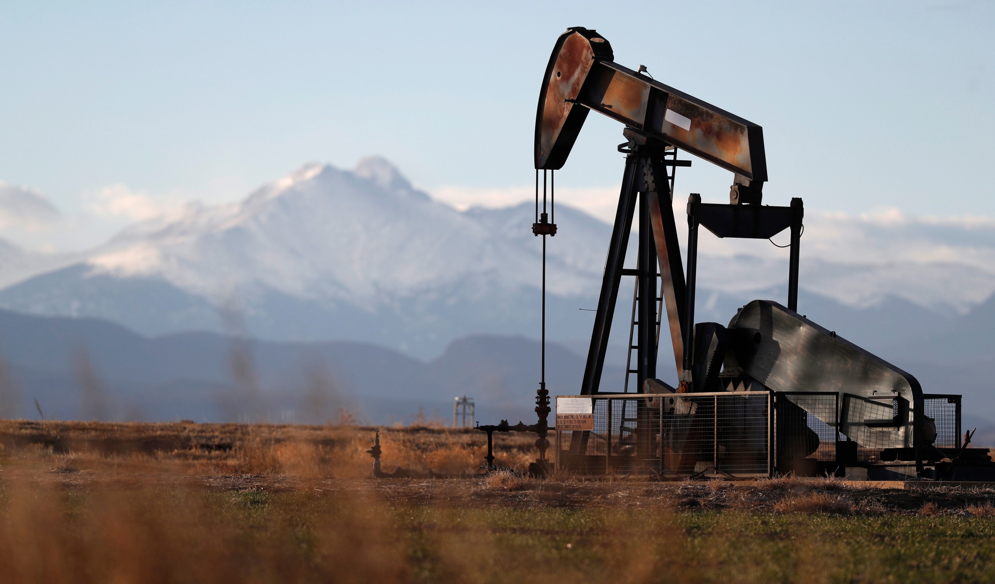 FILE - This Dec. 22, 2018, file photo shows a pump jack over an oil well along Interstate 25 near Dacono, Colo. (AP Photo/David Zalubowski, File) STATE OF UNION FACT CHECK