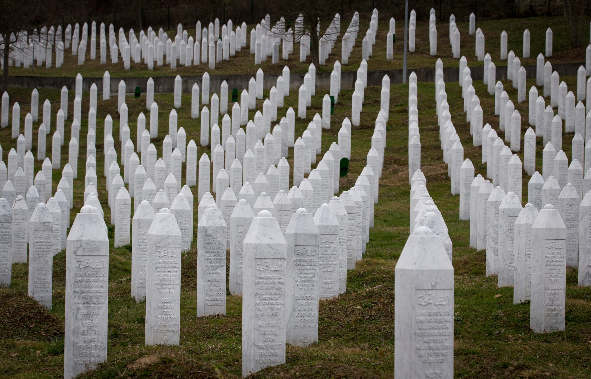 This Saturday, March 16, 2019 photo shows tombs at the memorial cemetery for massacre victims in Potocari, near Srebrenica, Bosnia-Herzegovina. Nearly a quarter of a century since Bosnia's devastating war ended, former Bosnian Serb leader Radovan Karadzic is set to hear the final judgment on whether he can be held criminally responsible for unleashing a wave of murder and mistreatment by his administration's forces. United Nations appeals judges on Wednesday March 20, 2019 will decide whether to uphold or overturn Karadzic's 2016 convictions for genocide, crimes against humanity and war crimes and his 40-year sentence. (AP Photo/Darko Bandic) War Crimes Karadzic
