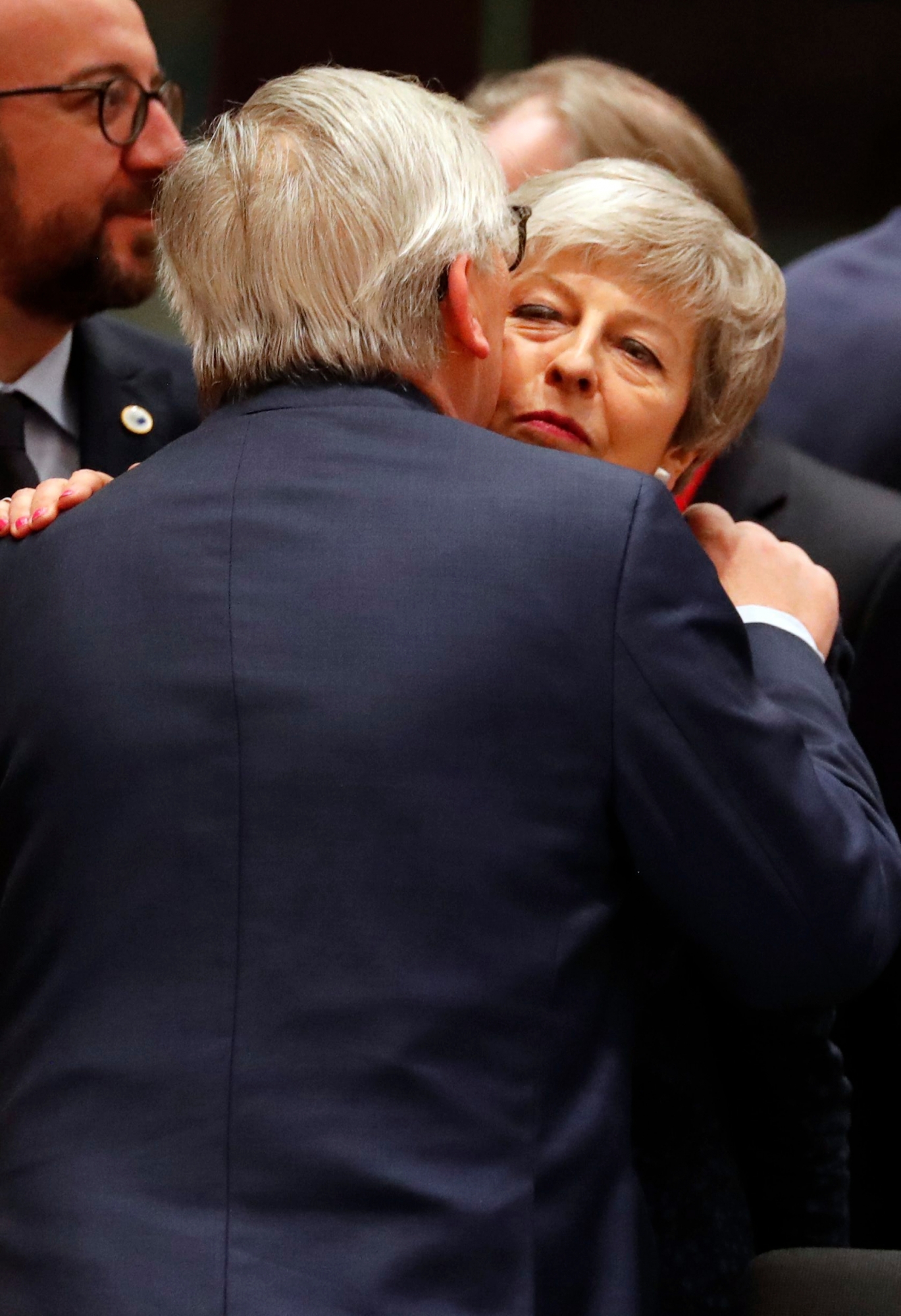 British Prime Minister Theresa May, right, is greeted by European Commission President Jean-Claude Juncker during a round table meeting at an EU summit in Brussels, Thursday, March 21, 2019. British Prime Minister Theresa May is trying to persuade European Union leaders to delay Brexit by up to three months, just eight days before Britain is scheduled to leave the bloc. (AP Photo/Frank Augstein) Belgium EU Brexit