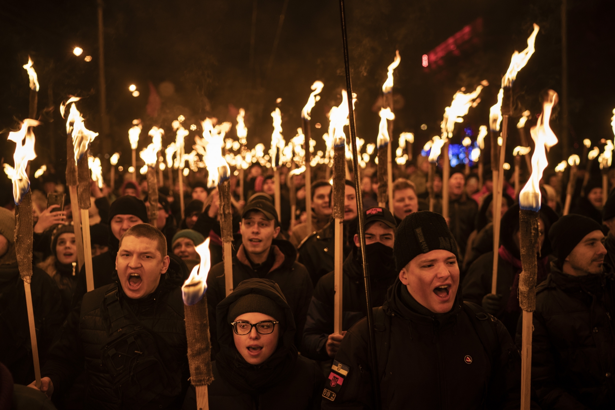 In this Jan. 1, 2019 photo, nationalists carry torches during a rally to mark the birthday of Stepan Bandera, founder of a rebel army that fought against the Soviet regime, in Kiev, Ukraine. The protests reflect the growing presence of far-right groups in Ukraine and their power in shaping the nationís political agenda. (AP Photo/Felipe Dana) Ukraine Ultra Right