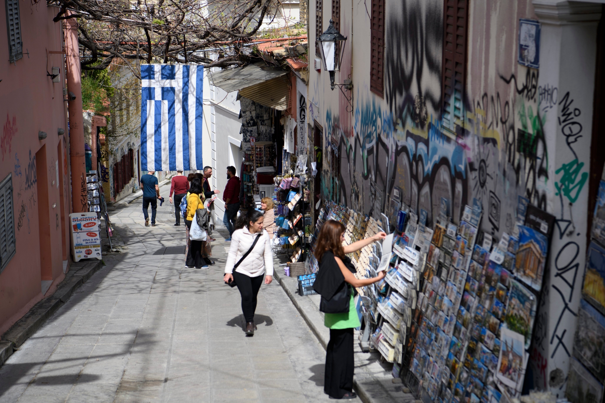 A greece flag is seen in a touristic street, in Athens, Greece, Wednesday, March 21, 2018. (KEYSTONE/Laurent Gillieron)
 GREECE ATHENS