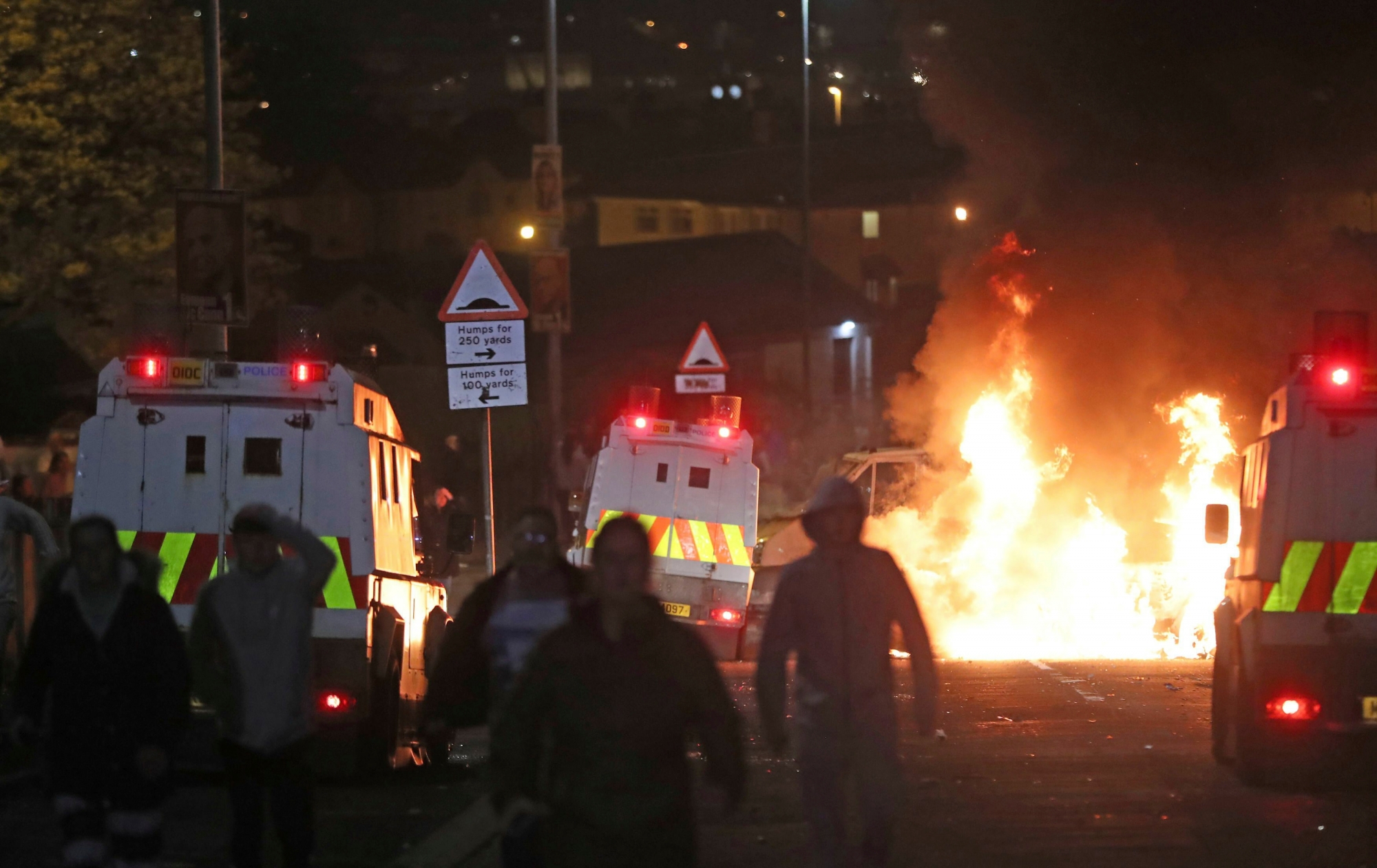 A car burns after petrol bombs were thrown at police in Creggan, Londonderry, in Northern Ireland, Thursday, April 18, 2019. (Niall Carson/PA via AP) Londonderry Unrest
