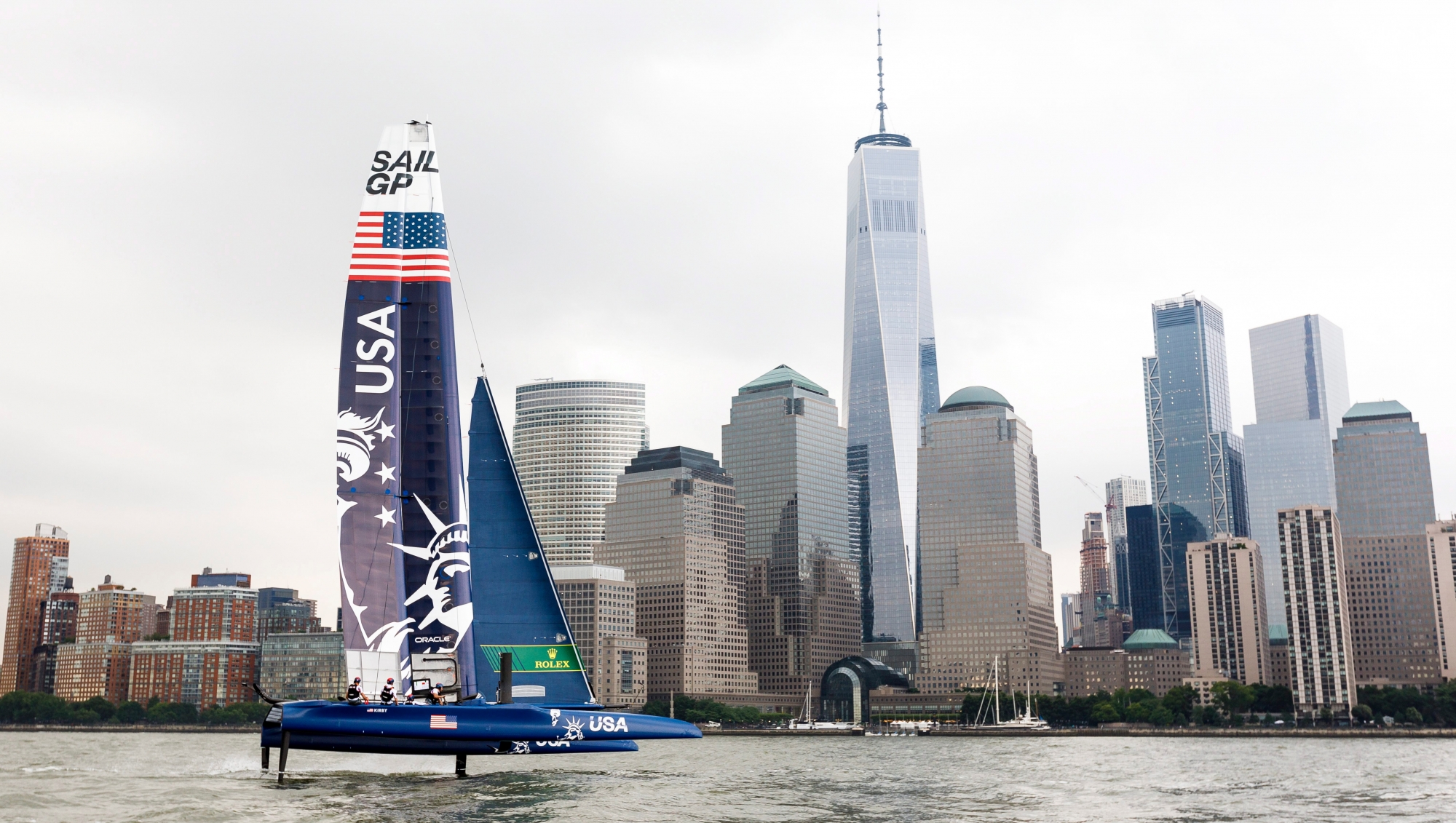 epa07654754 The US SailGP F50 catamaran boat (L) nicknamed 'Lady Liberty' tests the waters in New York Harbor as part of a preview of this week's New York SailGP Race in New York, New York, USA, 17 June 2019. The race, being held on 21 and 22 June, is part of a global competition of sailing teams from six countries using identical catamarans.  EPA/JUSTIN LANE USA NEW YORK SAILGP RACE PREVIEW