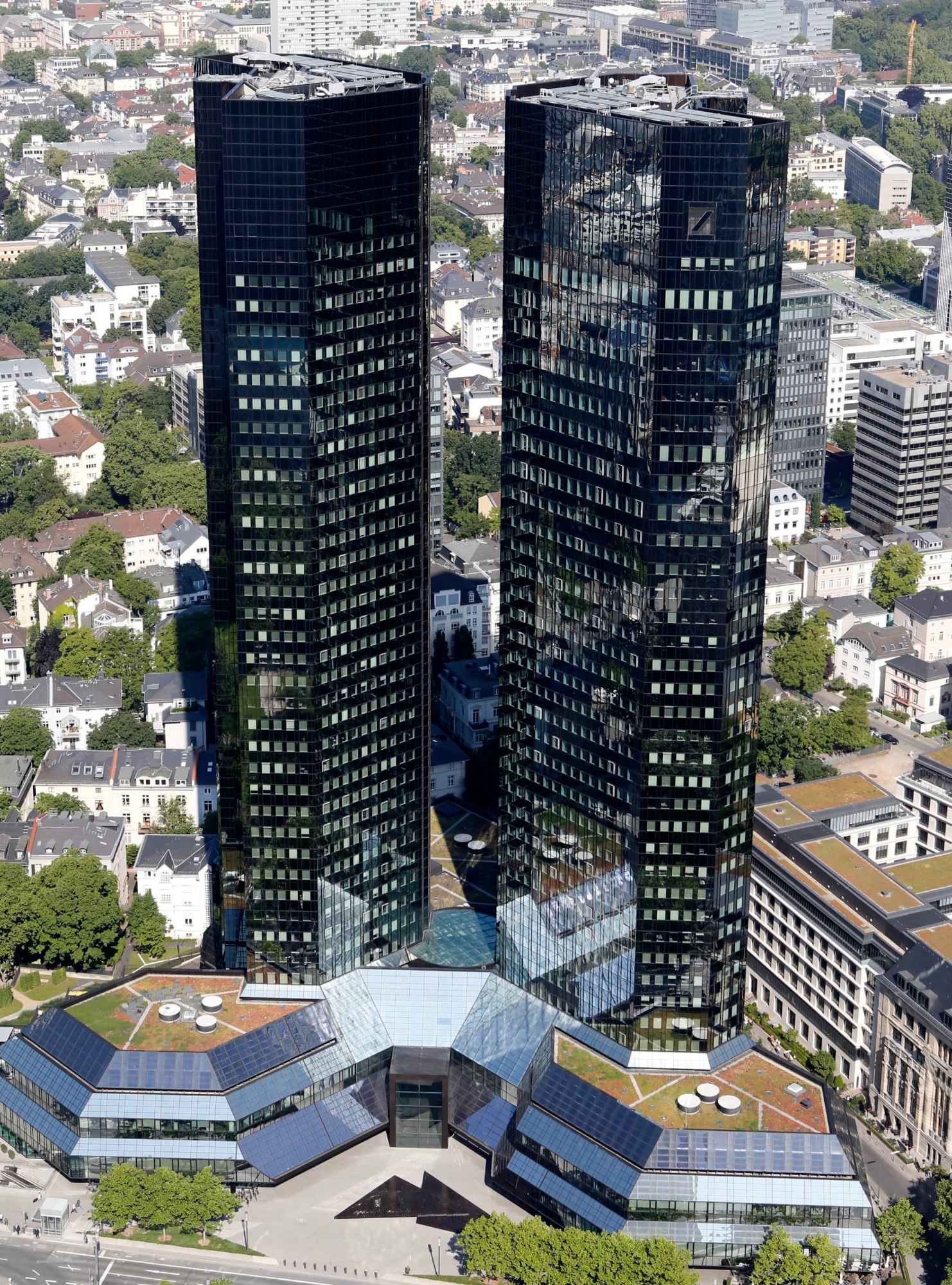 Deutsche Bank headquarters in Frankfurt, Germany, photographed Monday, May 19, 2014. Deutsche Bank AG says raising 8 billion euros (US $11 billion) in new capital from investors will strengthen its finances as it faces tighter regulation and uncertain costs from litigation.  (AP Photo/Michael Probst) Germany Deutsche Bank