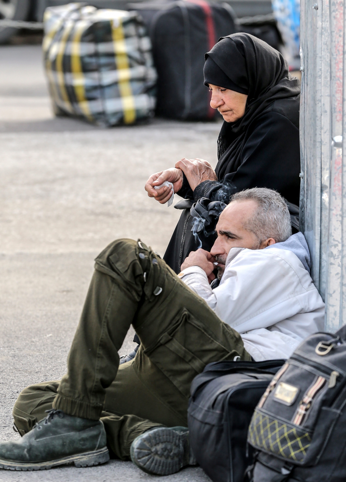 epa07491745 Syrian refugees gather as they wait to leave Beirut back to Syria, at the Bourj Hammoud area, northern Beirut, Lebanon, 08 April 2019. Reports state hundreds of Syrian refugees began their trip home on 08 April from different areas in Lebanon, as part of a coordinated operation between authorities in Beirut and Damascus. There are over one million Syrian refugees registered with the UNHCR in Lebanon, while the Lebanese government estimates some 1.5 million Syrians living in the country. EPA/NABIL MOUNZER LEBANON SYRIA REFUGEES RETURN