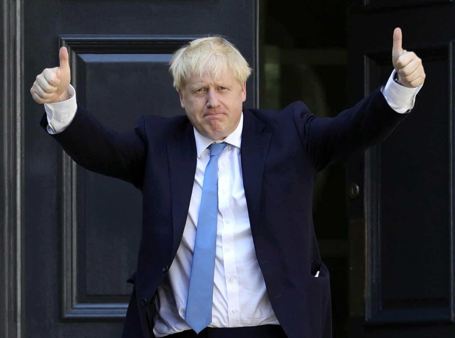 Newly elected leader of the Conservative party Boris Johnson arrives at Conservative party HQ in London, Tuesday, July 23, 2019. Brexit-hard-liner Boris Johnson, one of BritainÄôs most famous and divisive politicians, won the race to lead the governing Conservative Party on Tuesday, and will become the countryÄôs next prime minister in a little over 24 hours. (Aaron Chown/PA via AP) Britain Conservatives