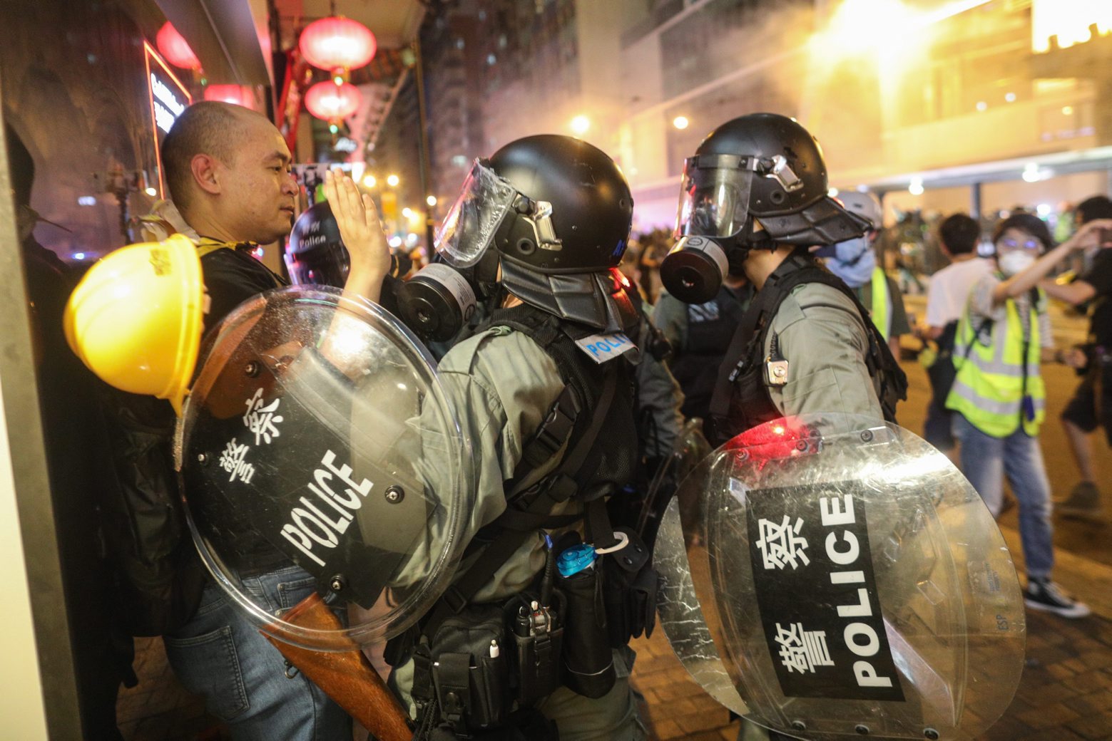 epa07745790 Riot police stop a protester taking part in a rally against the police brutality in Hong Kong, China, 28 July 2019. Hong Kong has a new mass rally with demonstrators protesting against the police brutality on 27 July in Yuen Long, another mass protest was held and ended up with clashes between protesters and the police when riot police fired rubber bullets, tear gas and pepper spray to disperse the crowd.  EPA/JEROME FAVRE CHINA HONG KONG PROTEST RALLY