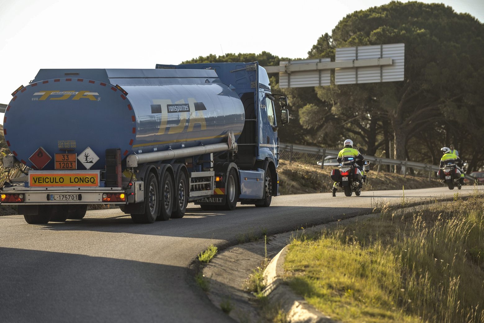 epa07769540 Members of the National Republican Guard (GNR) gendarmerie force escort a truck carrying fuel outside the headquarters of the Logistics Fuel Company (CLC) in Aveiras de Cima, Portugal, 12 August 2019, during the indefinite strike of dangerous goods drivers. The Portuguese government has decreed minimum services between 50 percent and 100 percent, and declared an energy crisis. The move implies 'exceptional measures' to minimize the impact of the strike of dangerous goods drivers in order to guarantee the supply of essential services such as security forces and medical emergency.  EPA/CARLOS BARROSO