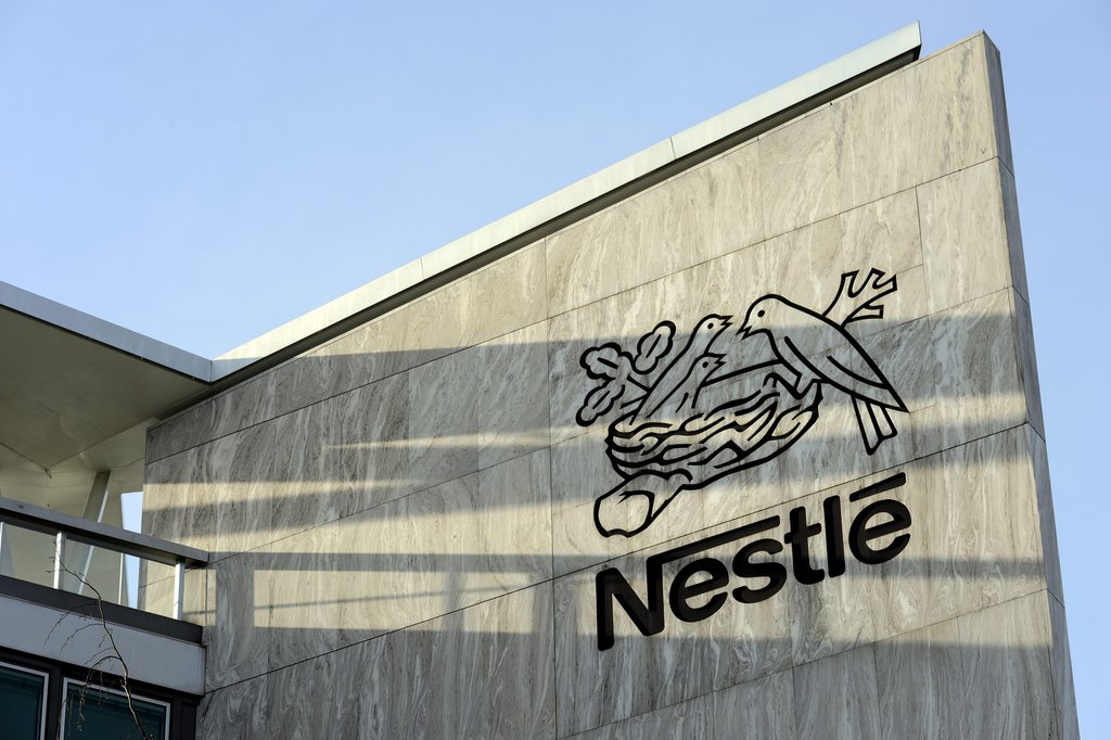 Nestle logo is pictured on the Nestle headquarter before the 2012 full-year results press conference of the food and drinks giant Nestle in Vevey, Switzerland, Thursday, February 14, 2013. Nestle SA, the world's biggest food and drinks maker, overcame tough global economic conditions to post a full-year net profit Thursday of 10.6 billion Swiss francs ($11.55 billion) for 2012, but predicted another challenging year ahead. (KEYSTONE/Laurent Gillieron)