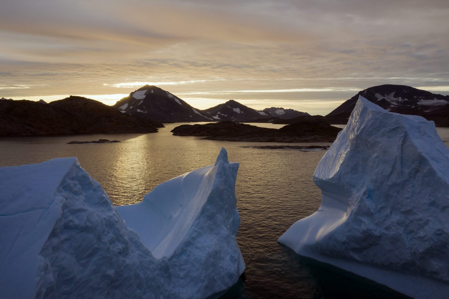 An aerial view of large Icebergs floating as the sun rises near Kulusuk, Greenland, early Friday, Aug. 16, 2019. Greenland has been melting faster in the last decade and this summer, it has seen two of the biggest melts on record since 2012. (AP Photo/Felipe Dana) Greenland Glaciers