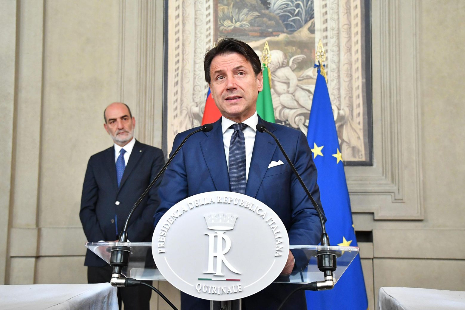 Designate premier Giuseppe Conte delivers his speech after a meeting with President Sergio Mattarella at Rome's Quirinale presidential palace, Thursday, Aug. 29, 2019. Italy's president has given the recently resigned premier, Giuseppe Conte, a fresh mandate to see if he can cobble together a new government backed by the populist 5-Star Movement and center-left Democrats. (Alessandro Di Met/ANSA via AP) Italy Politics
