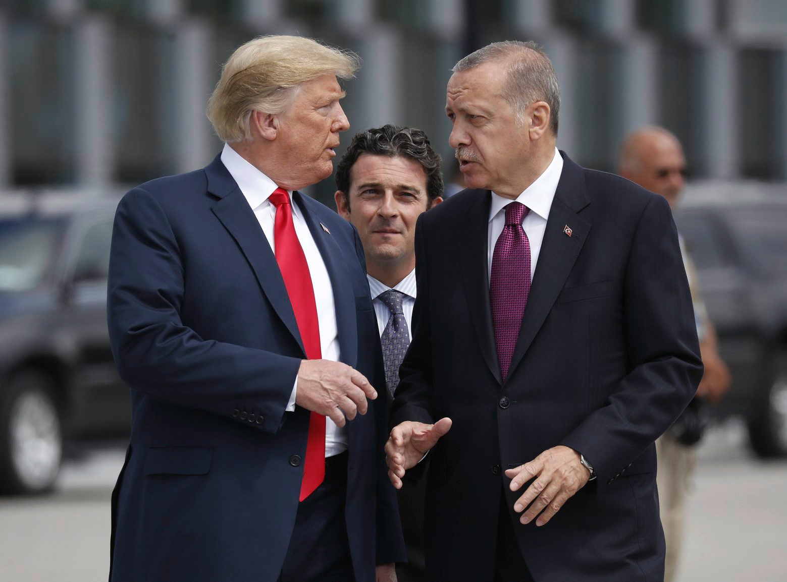 FILE - In this Wednesday, July 11, 2018, file photo, President Donald Trump, left, talks with Turkey's President Recep Tayyip Erdogan, as they arrive together for a family photo at a summit of heads of state and government at NATO headquarters in Brussels. The White House says Turkey will soon invade Northern Syria, casting uncertainty on the fate of the Kurdish fighters allied with the U.S. against in a campaign against the Islamic State group. (AP Photo/Pablo Martinez Monsivais, File)
Donald Trump,Recep Tayyip Erdogan United States Syria