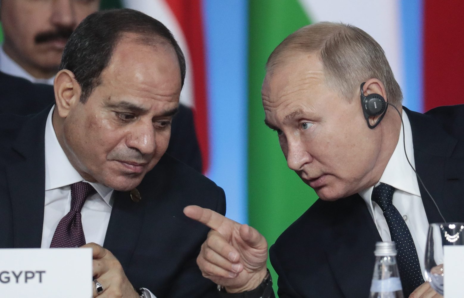Russian President Vladimir Putin, right, gestures while speaking to Egyptian President Abdel Fattah el-Sisi during a plenary session at the Russia-Africa summit in the Black Sea resort of Sochi, Russia, Thursday, Oct. 24, 2019. (Sergei Chirikov/Pool Photo via AP) Russia Africa