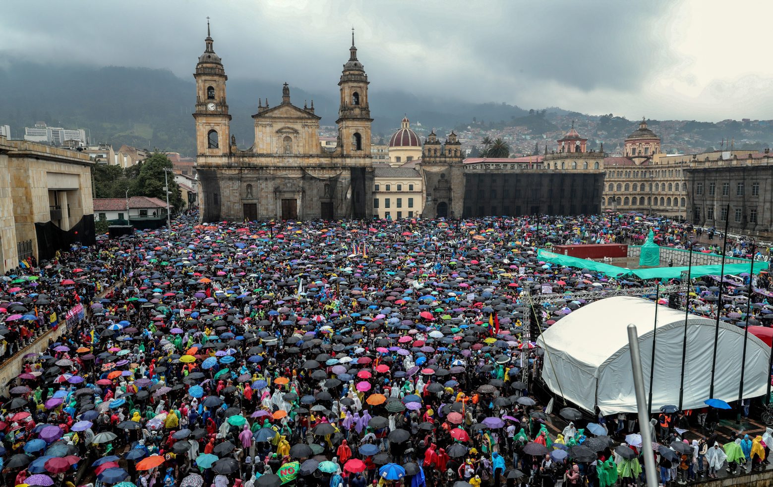 epaselect epa08015846 Thousands of people take part in a protest during the National Strike, in the Bolivar Square of Bogota, Colombia, 21 November 2019. Colombian students and workers took the streets of the country to protest against the economic and social policy of President Ivan Duque.  EPA/Diego Bauman epaselect COLOMBIA PROTESTS