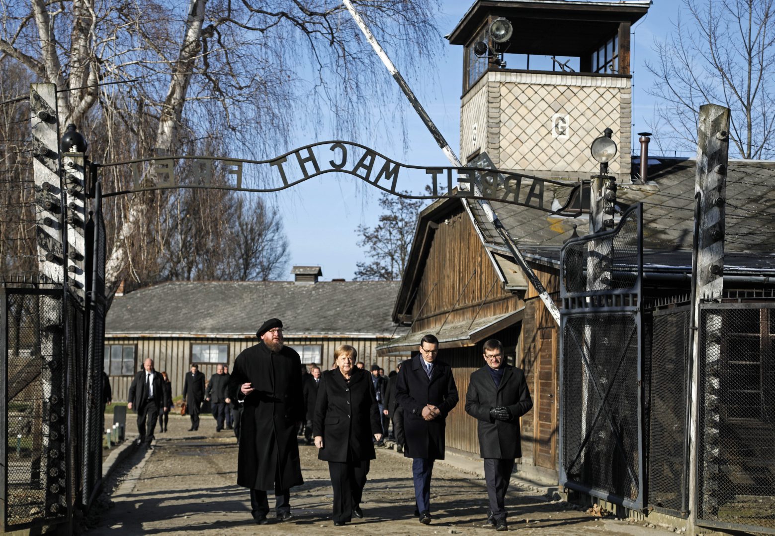 Museum director Piotr Cywinski, German Chancellor Angela Merkel, Polish Prime Minister Mateusz Morawiecki and deputy director Andrzej Kacorzyk, from left, visit the former Nazi death camp of Auschwitz-Birkenau in Oswiecim, Poland on Friday, Friday, Dec. 6, 2019. Merkel attend an event in occasion of the 10th anniversary of the founding of the Auschwitz Foundation. (Photo/Markus Schreiber) Poland Germany Auschwitz