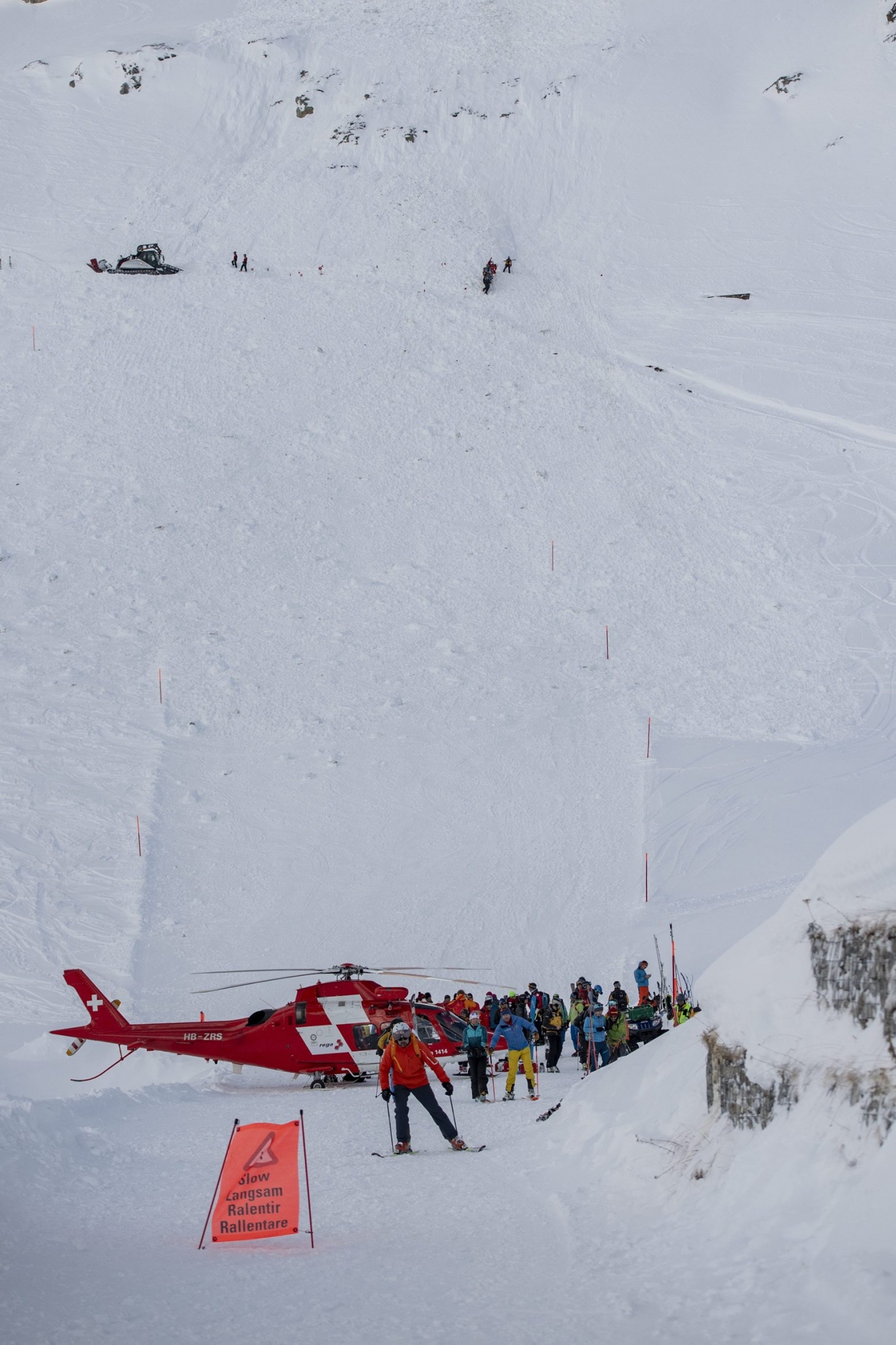 Rescue forces and helicopters still search for missed persons after an avalanche swept down a ski piste in the central town of Andermatt in canton Uri, Switzerland, Thursday, December 26, 2019. Six people have been rescued, two of them with minor injuries but cantonal authorities fear that several other people may be buried. An extensive rescue operation is underway. (KEYSTONE/Urs Flueeler) SWITZERLAND AVALANCHE