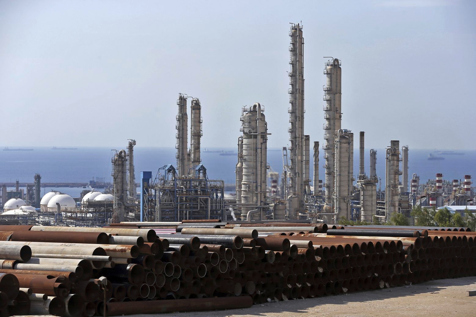 FILE - This Nov. 19, 2015,c file photo, shows a general view of a petrochemical complex in the South Pars gas field in Asalouyeh, Iran, on the northern coast of Persian Gulf. The U.S. airstrike that killed a prominent Iranian general in Baghdad raises tensions even higher between Tehran and Washington after months of trading attacks and threats across the wider Middle East. (AP Photo/Ebrahim Noroozi) Explains Iran US