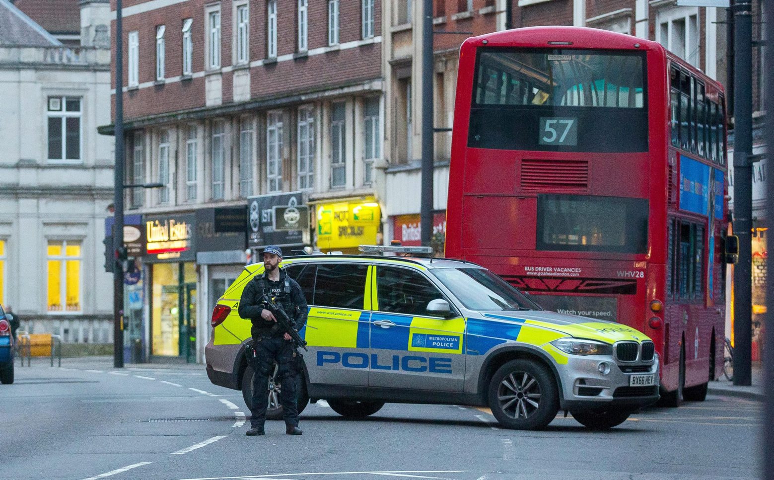 epa08188350 An armed policeman secures the site of an incident after a man has been shot by armed police at a street in Streatham, London, Britain, 02 February 2020. According to reports, a man has been shot by police in terrorist-related incident. Reports also state several people have been stabbed.  EPA/STR BRITAIN LONDON STREATHAM TERROR INCIDENT