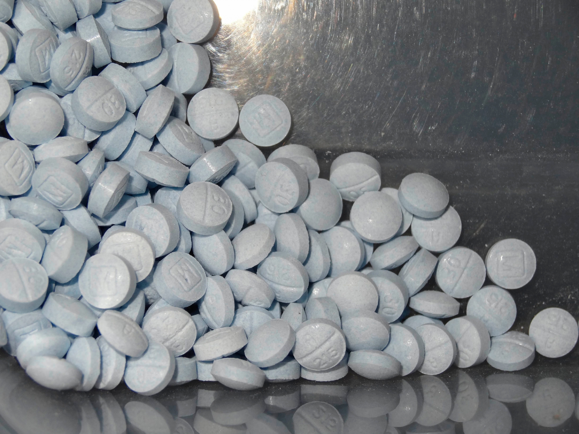 FILE - This undated file photo provided by the U.S. Attorneys Office for Utah and introduced as evidence at a trial shows fentanyl-laced fake oxycodone pills collected during an investigation. Accidental overdoses contribute to 90 percent of all U.S. opioid-related deaths. Rising use of illicitly manufactured and highly potent synthetic opioids including fentanyl has likely contributed to the unintentional death rate, which surged nine-fold between 2000 and 2017, the study found. (U.S. Attorneys Office for Utah via AP, File) OPIOID DEATHS