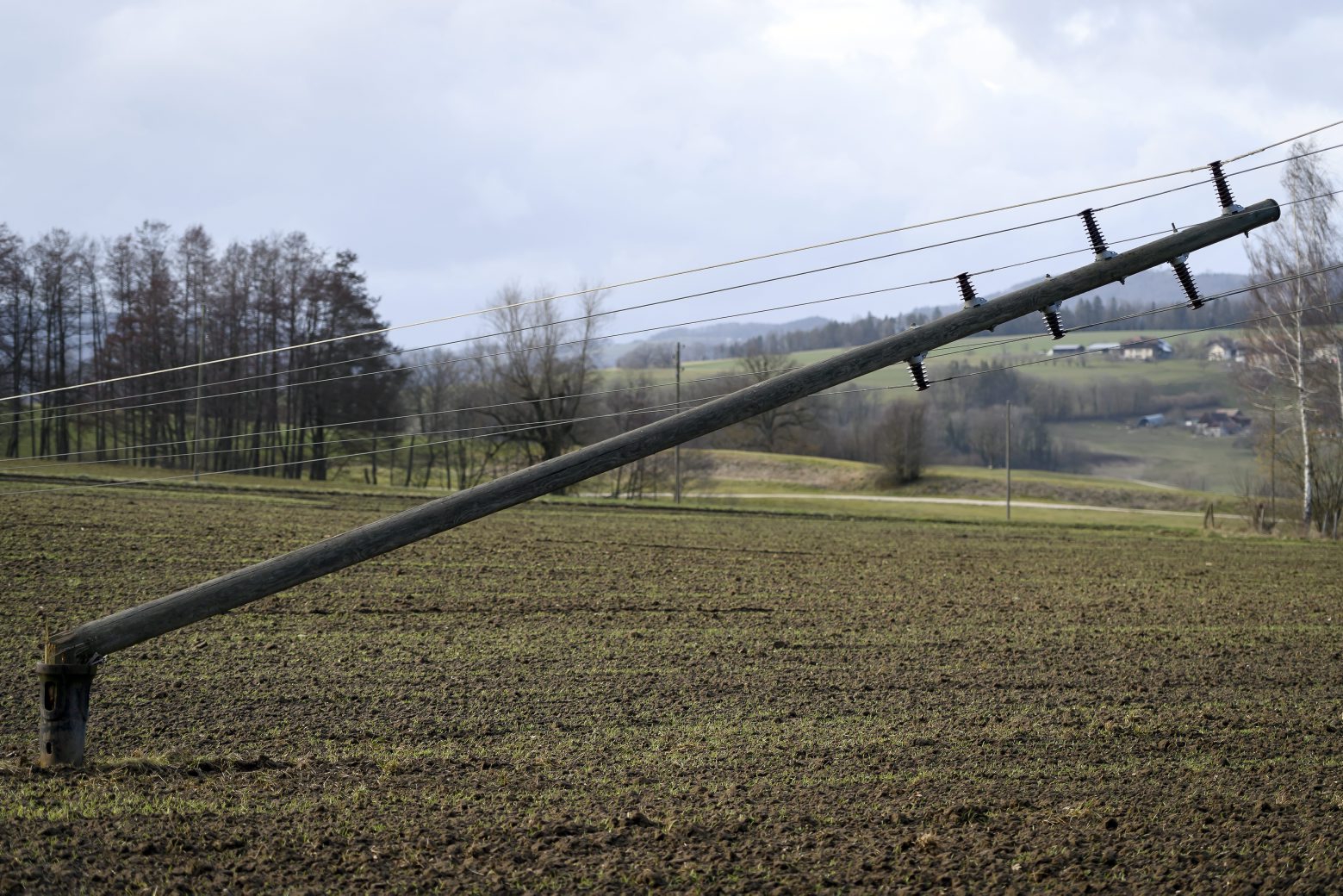 Power lines is lying in a field during the storm Ciara in Courtetelle, Switzerland, Monday, February 10, 2020. Severe warnings have been issued for Western and Northern Europe as storm Ciara (also known as Sabine in Germany, and Switzerland and Elsa in Norway) is bringing strong winds and heavy rains causing disruption of land and air traffic. Winter storm Ciara reached Switzerland last night. (KEYSTONE/Anthony Anex) SWITZERLAND WEATHER STORM CIARA
