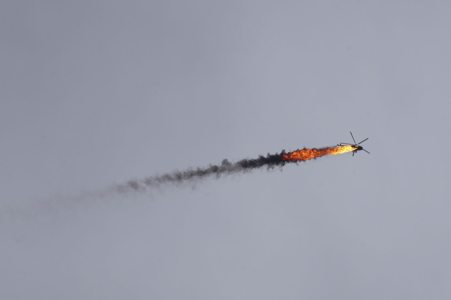 Syrian government helicopter is shot by a missile in Idlib province, Syria, Tuesday, Feb. 11, 2020. Syrian rebels shot down a government helicopter Tuesday in the country's northwest where Syrian troops are on the offensive in the last rebel stronghold. (AP Photo/Ghaith Alsayed) APTOPIX Syria