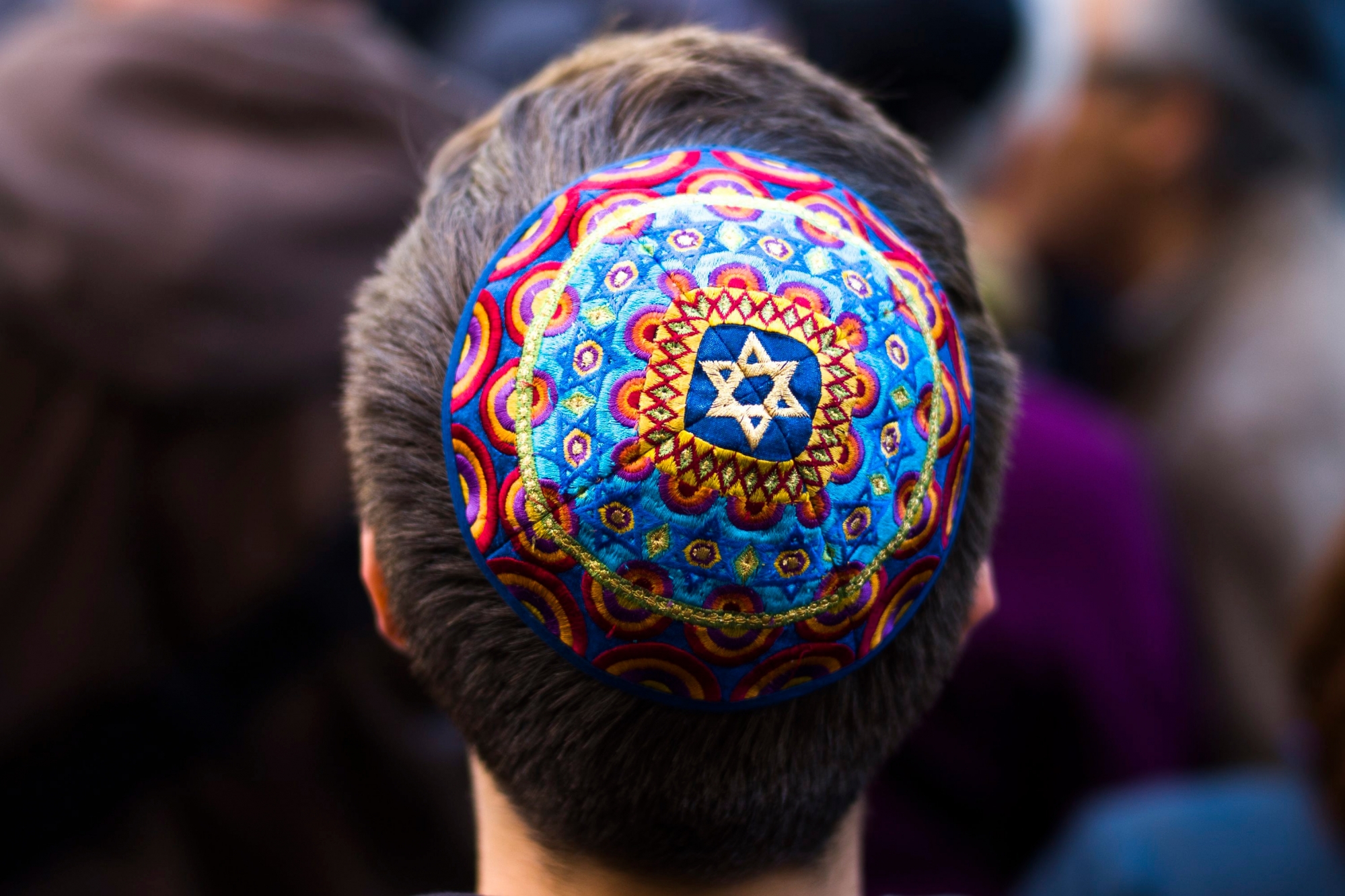 A man wears a Jewish skullcap, as he attends a demonstration against an anti-Semitic attack in Berlin, Wednesday, April 25, 2018. (AP Photo/Markus Schreiber) Germany Anti Semitism