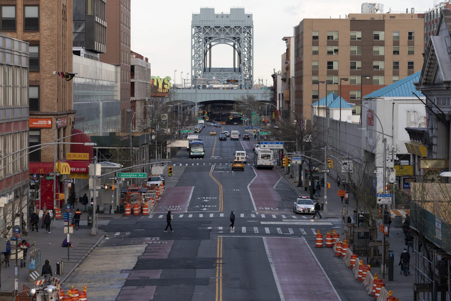 There is little traffic on 125th Street, Thursday, April 16, 2020, in the Harlem neighborhood of New York during the coronavirus pandemic. Gov. Andrew Cuomo extended stay-at-home restrictions Thursday through mid-May. (AP Photo/Mark Lennihan) Virus Outbreak New York