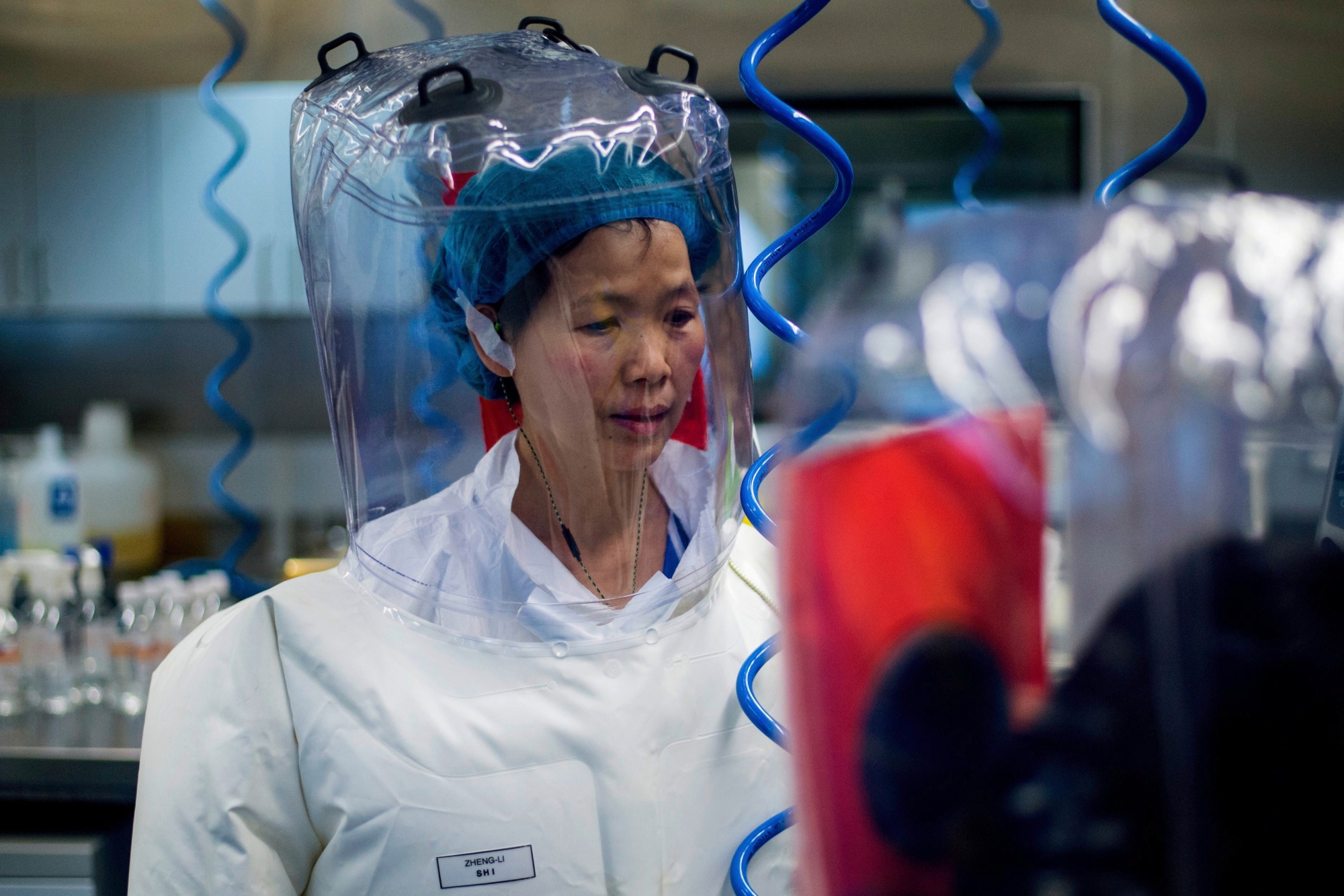 Chinese virologist Shi Zhengli is seen inside the P4 laboratory in Wuhan, capital of China's Hubei province, on February 23, 2017. - The P4 epidemiological laboratory was built in co-operation with French bio-industrial firm Institut Merieux and the Chinese Academy of Sciences. (Photo by Johannes EISELE / AFP) CHINA-FRANCE-DIPLOMACY