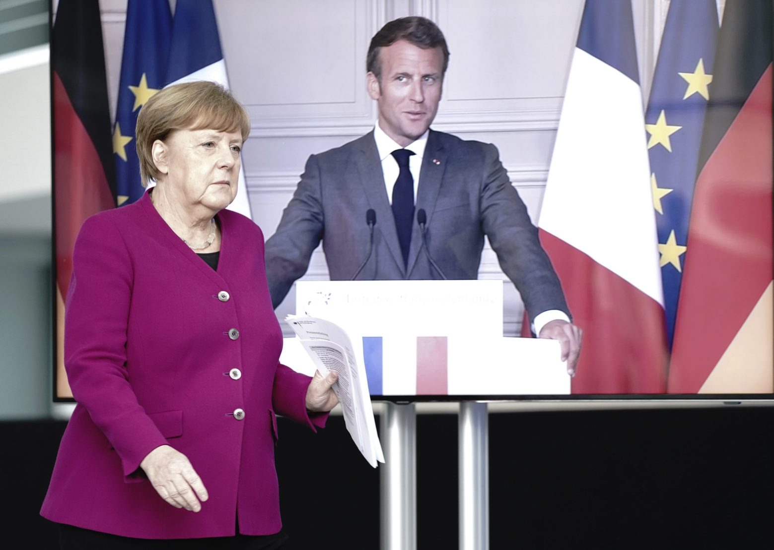 German Chancellor Angela Merkel arrives for a news conference with French President Emmanuel Macron, connected by video, after a joint video conference in Berlin, Germany, Monday, May 18, 2020. One topic was the corona pandemic and its consequences. (Kay Nietfeld/dpa via AP) Virus Outbreak Germany France