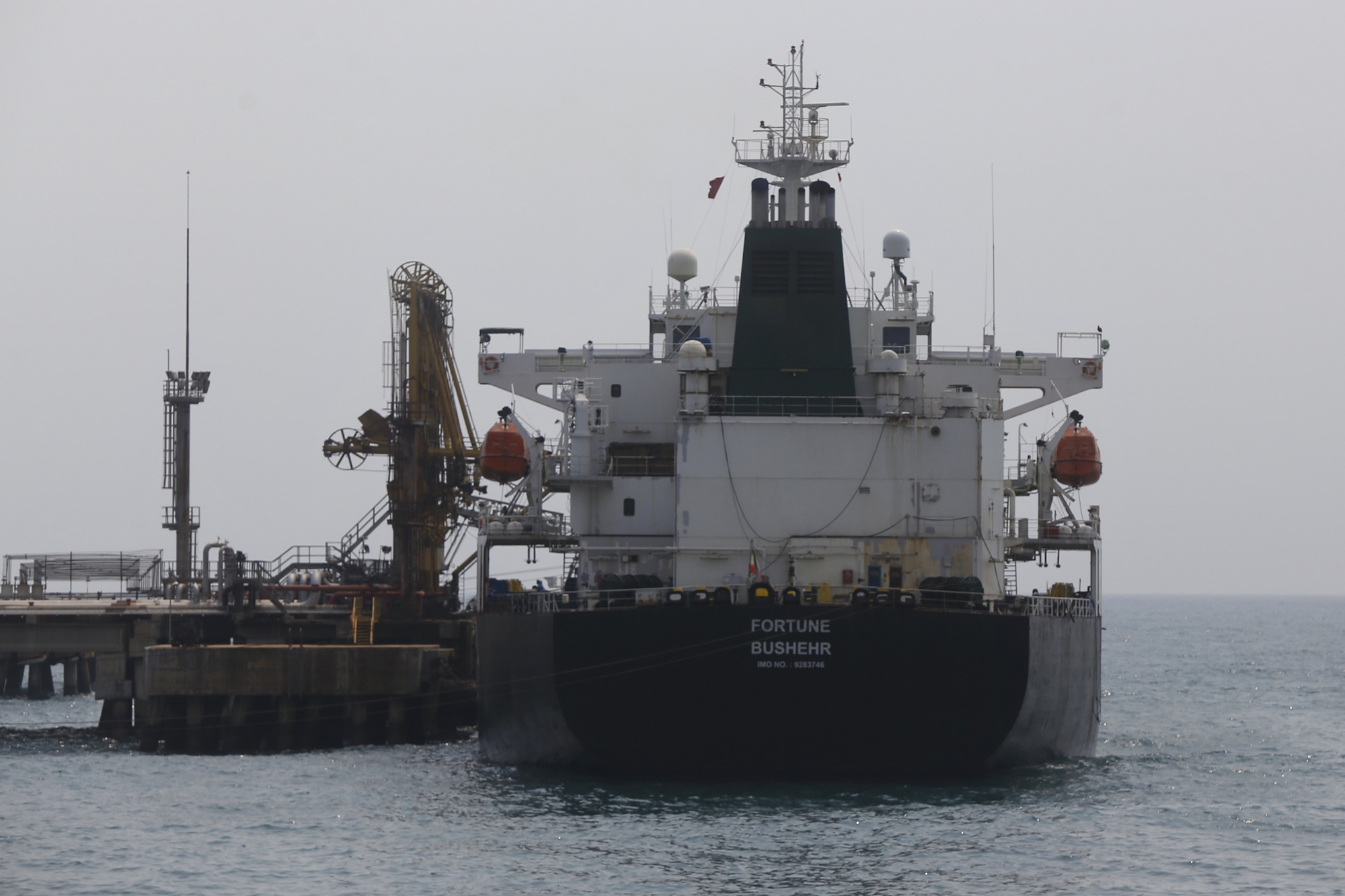 Iranian oil tanker Fortune is anchored at the dock of the El Palito refinery near Puerto Cabello, Venezuela, Monday, May 25, 2020. The first of five tankers loaded with gasoline sent from Iran is expected to temporarily ease Venezuela's fuel crunch while defying Trump administration sanctions targeting the two U.S. foes. (AP Photo/Ernesto Vargas) Venezuela Iran