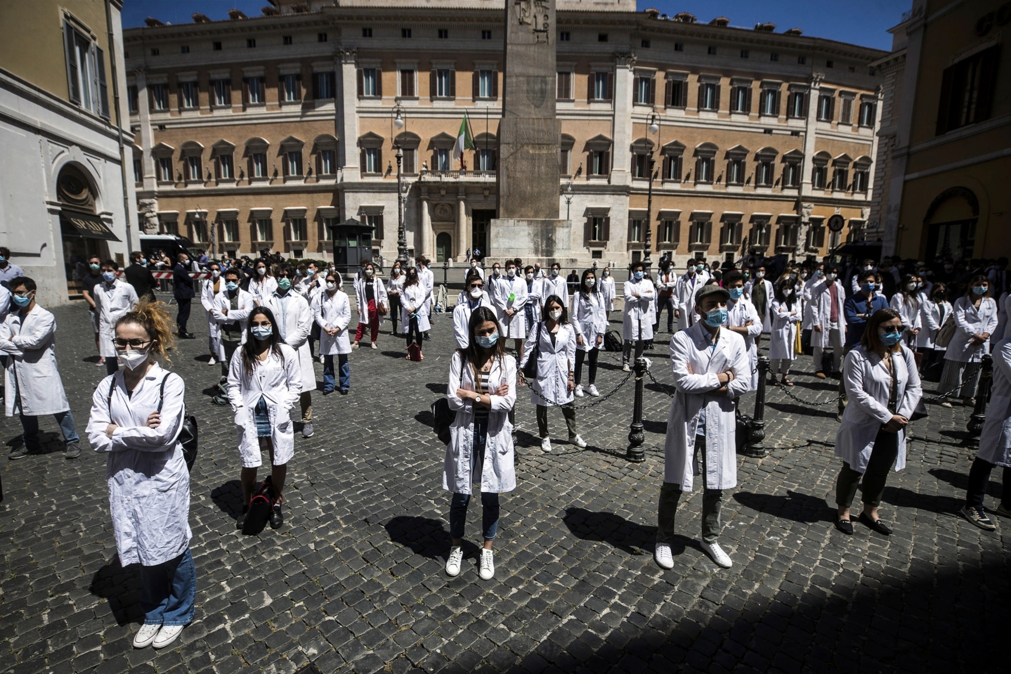 epa08446923 Medical students, graduate students and young doctors protest in front of the Italian Parliament during the second phase of the coronavirus disease (COVID-19) pandemic, emergency in Rome, Italy, 27 May 2020. According to media reports, demonstrators denounced the fragility of the national health system.  EPA/ANGELO CARCONI
ArcInfo