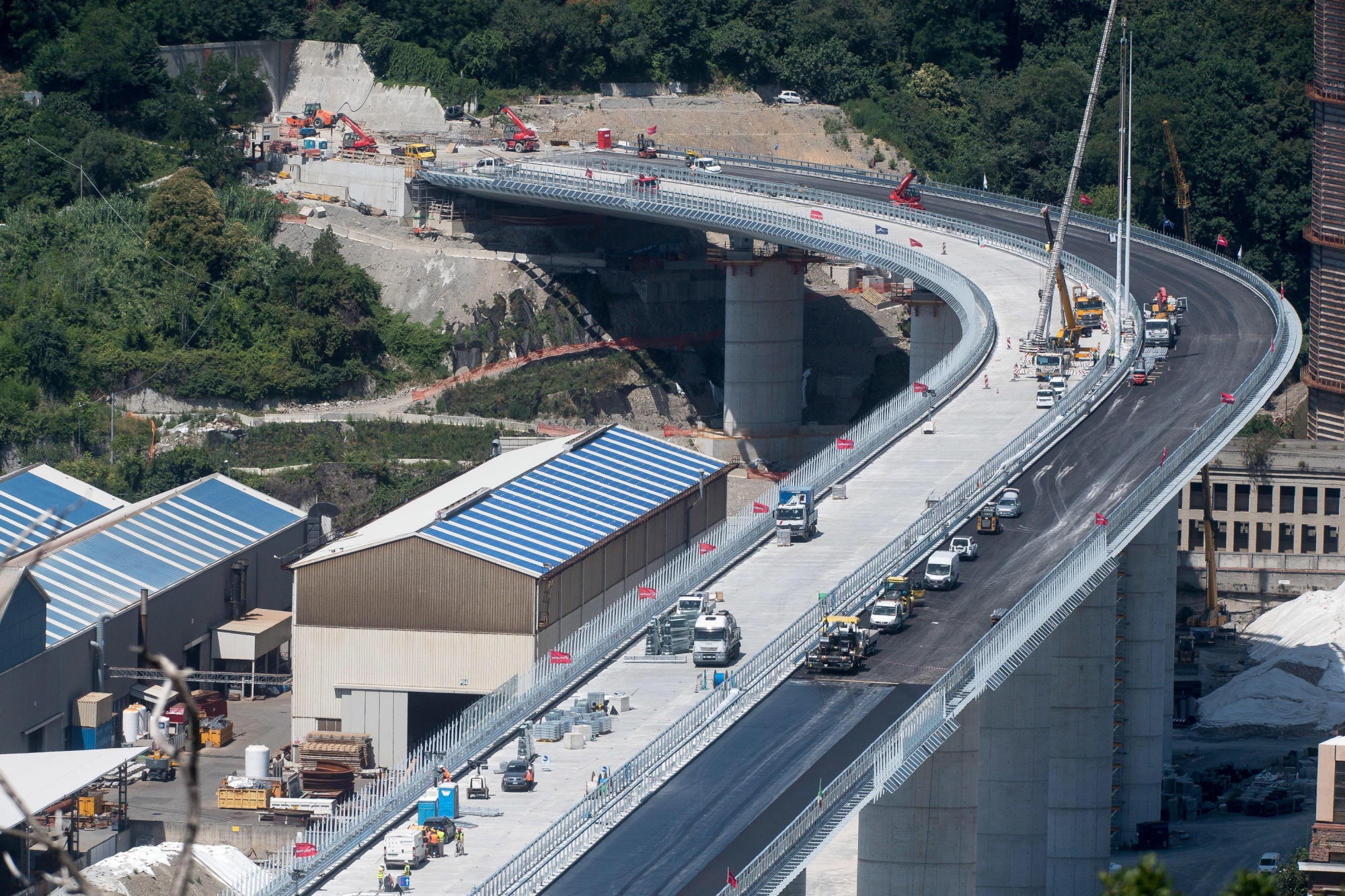 epa08536561 A view of the new Genoa motorway bridge construction site, in Genoa, Italy, 09 July 2020.The new bridge is under construction after the Morandi highway bridge partially collapsed on 14 August 2018, killing a total of 43 people.  EPA/LUCA ZENNARO
ArcInfo