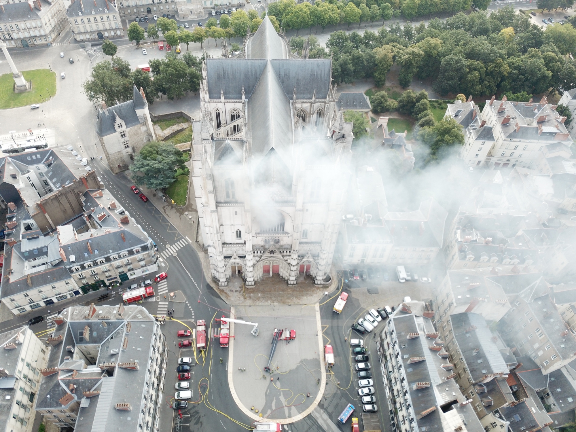 In this image provided by SDIS 44 Department of Fire and Rescue, fire fighters work to extinguish the blaze at the Gothic St. Peter and St. Paul Cathedral, in Nantes, western France, Saturday, July 18, 2020. French officials launched an arson inquiry Saturday after the fire broke out destroying the organ, shattered stained glass windows and sent black smoke spewing from between the cathedral towers. (SDIS 44 Department of Fire and Rescue via AP) ArcInfo